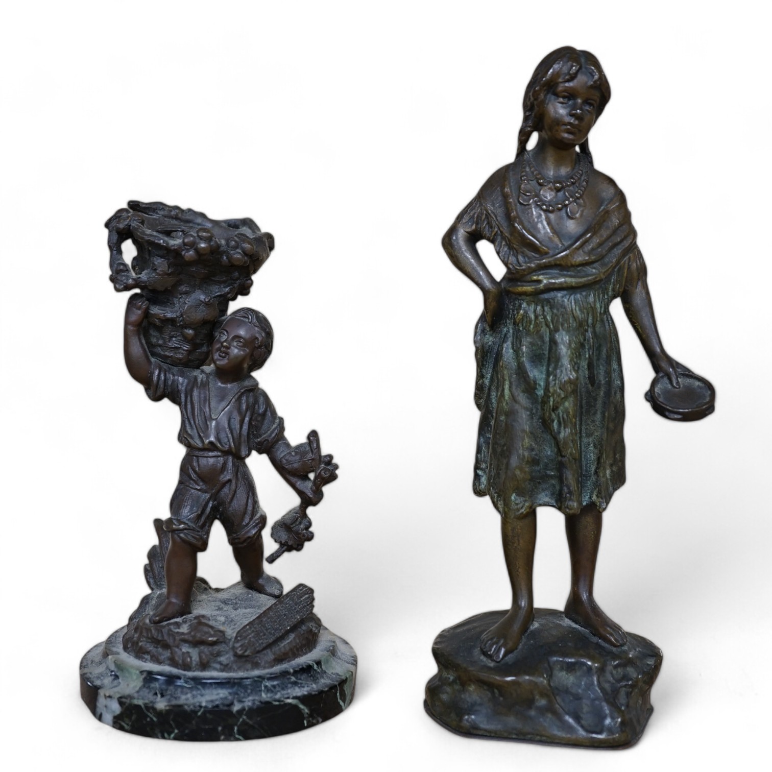 A bronze study of a girl holding a tambourine, and a bronze boy carrying grapes, raised on marble base, largest 16cm high. Condition - good                                                                                 