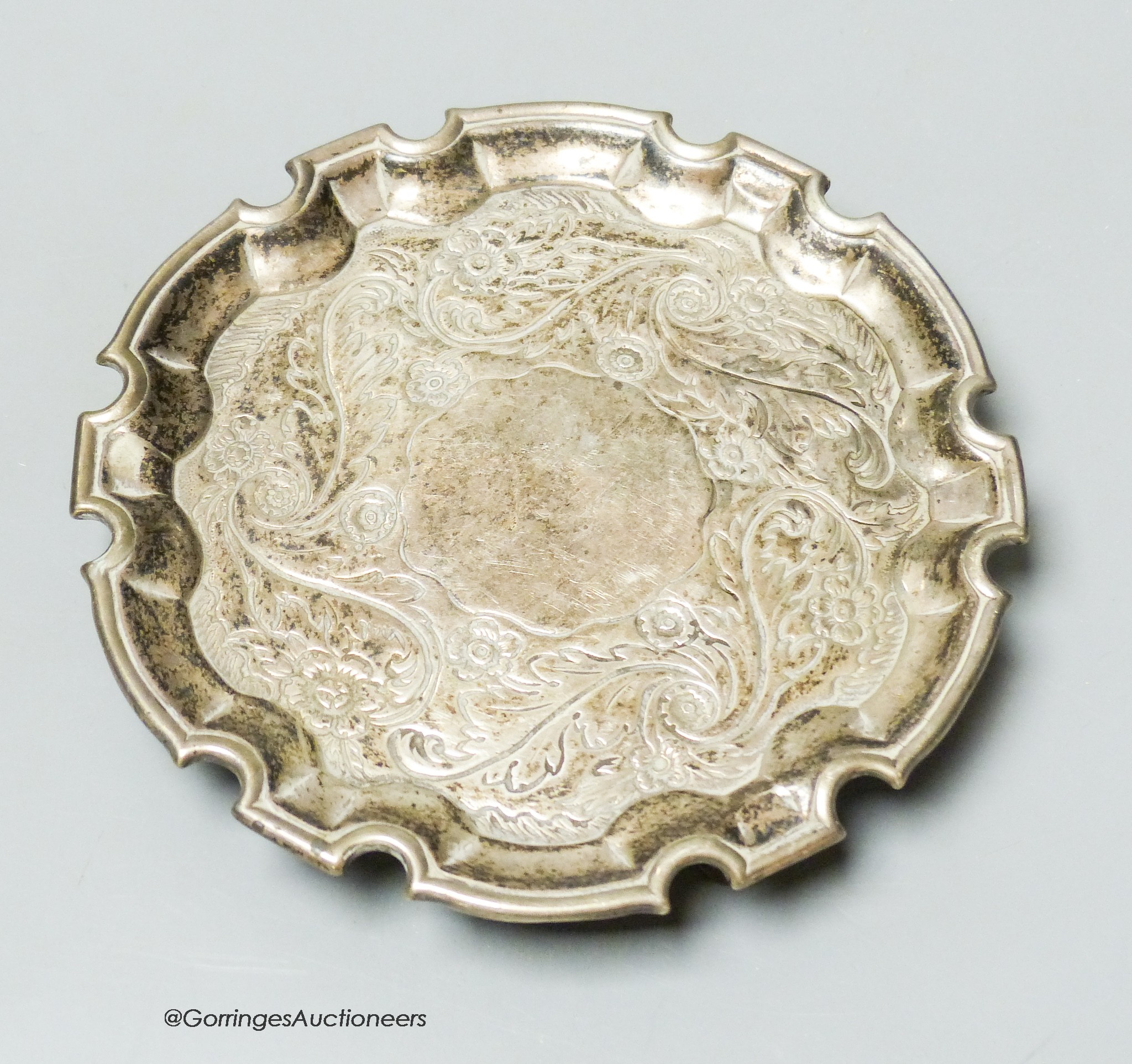 A George II silver salver with later embossed decoration, Robert Abercrombie, London, circa 1730, 15.cm, 6.5oz.                                                                                                             