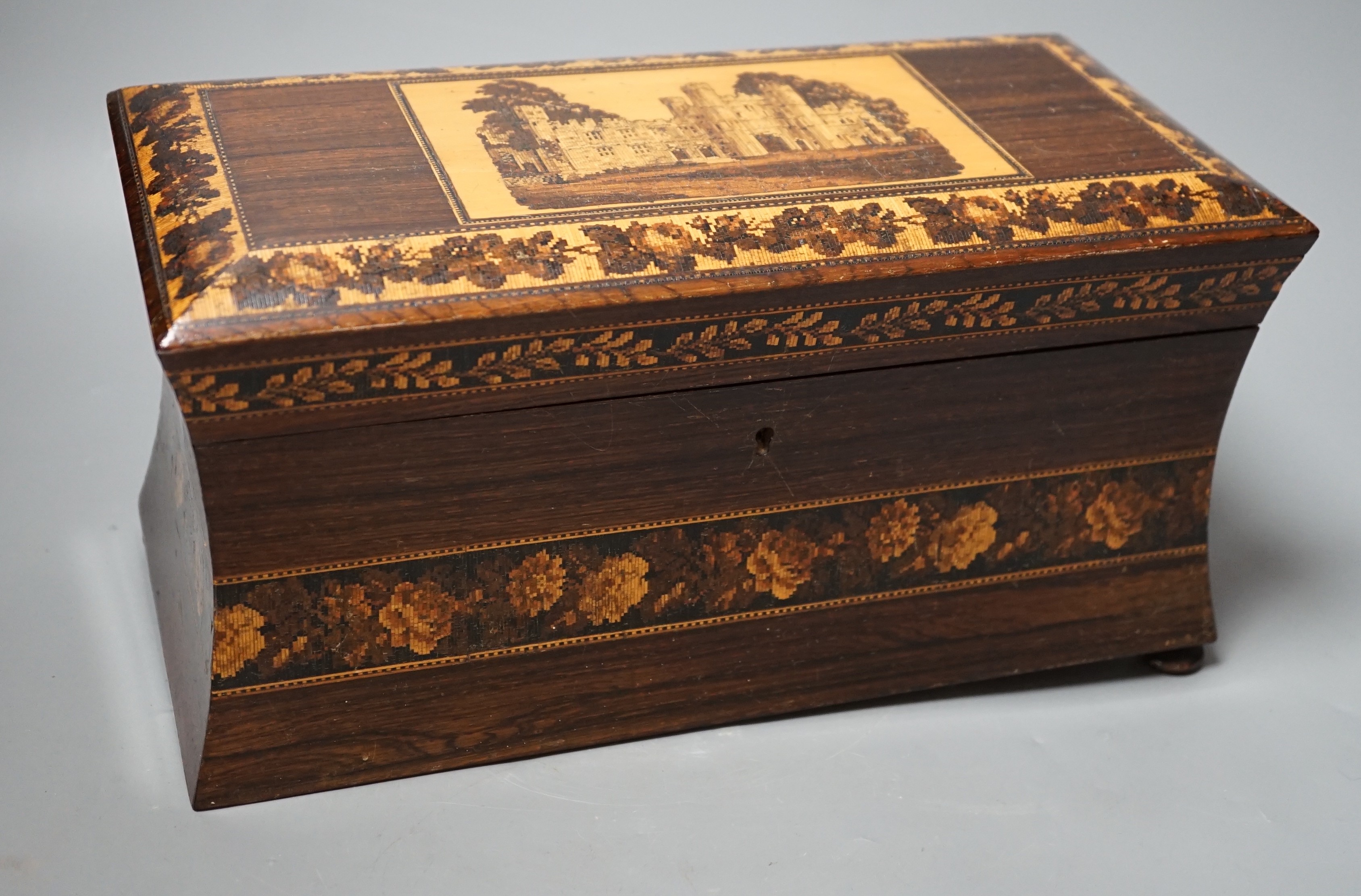 A late 19th century Tunbridge ware tea caddy depicting Eridge Castle, 31cm wide                                                                                                                                             