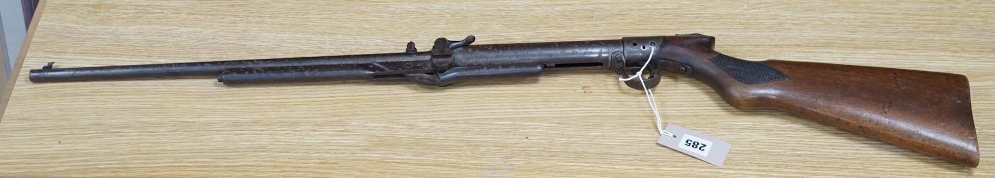 A spring loaded air rifle, early 20th century, 98cms long                                                                                                                                                                   