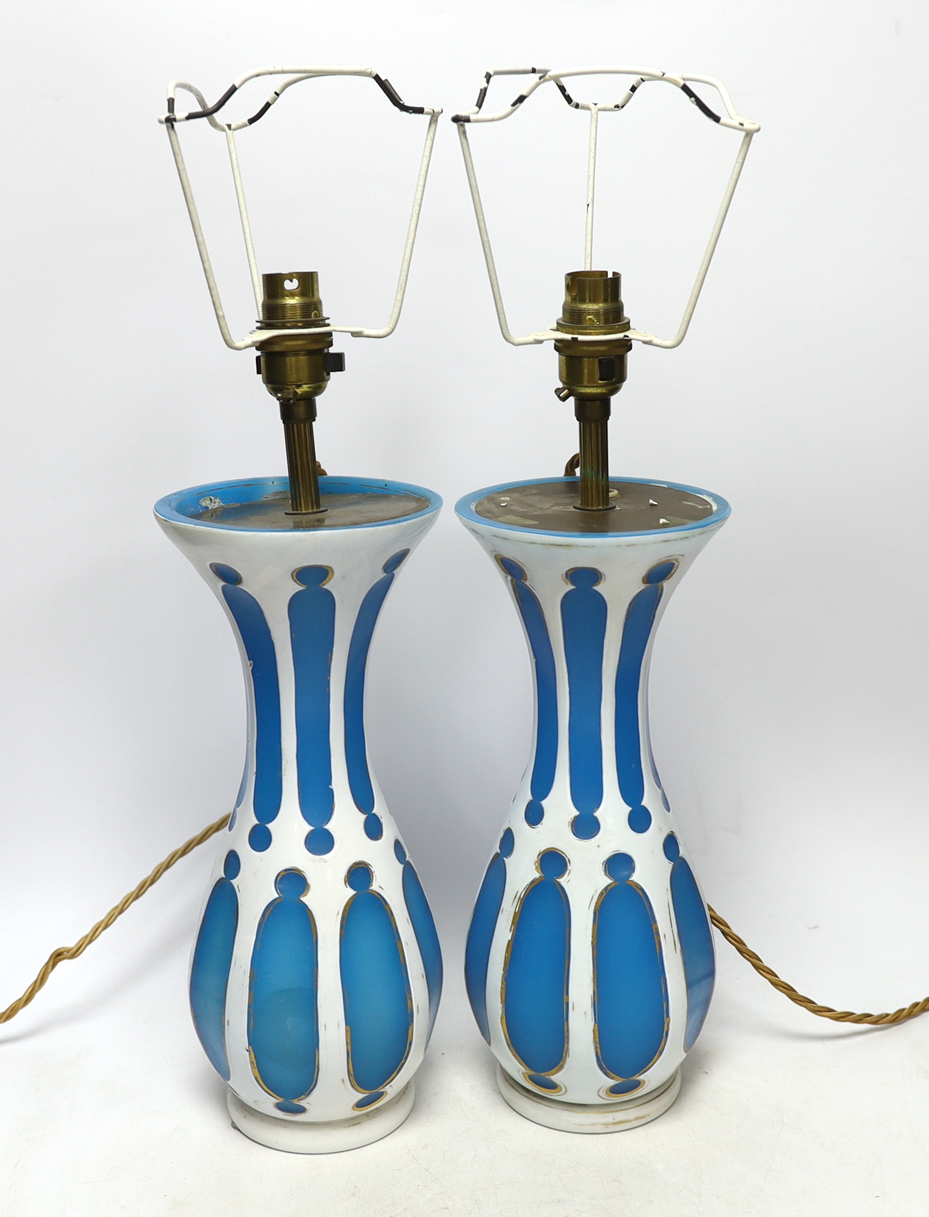 A pair of Bohemian overlaid glass vases, mounted as lamps                                                                                                                                                                   