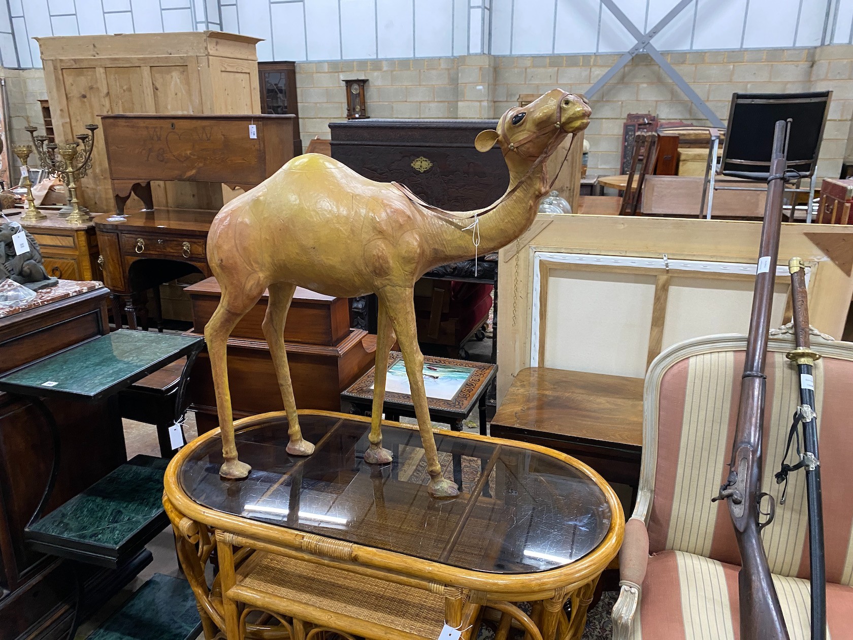 A large leather model of a camel, height 84cm                                                                                                                                                                               