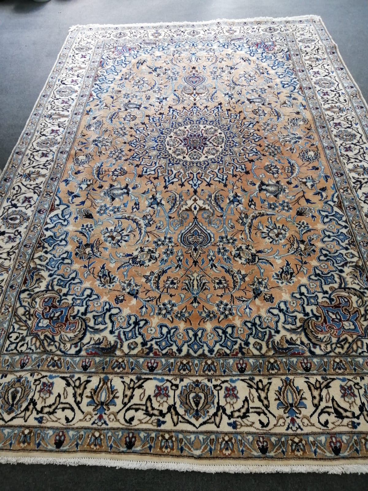 A Nain ivory ground carpet, 305 x 197cm                                                                                                                                                                                     