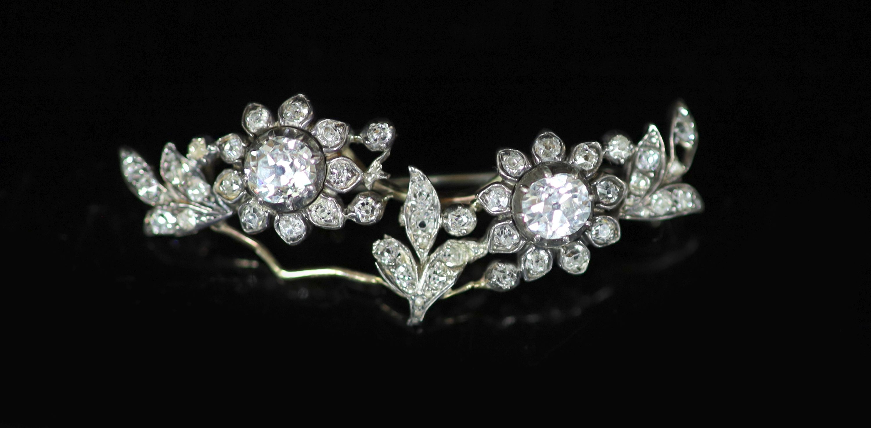 A late Victorian gold, silver and diamond cluster set foliate brooch                                                                                                                                                        