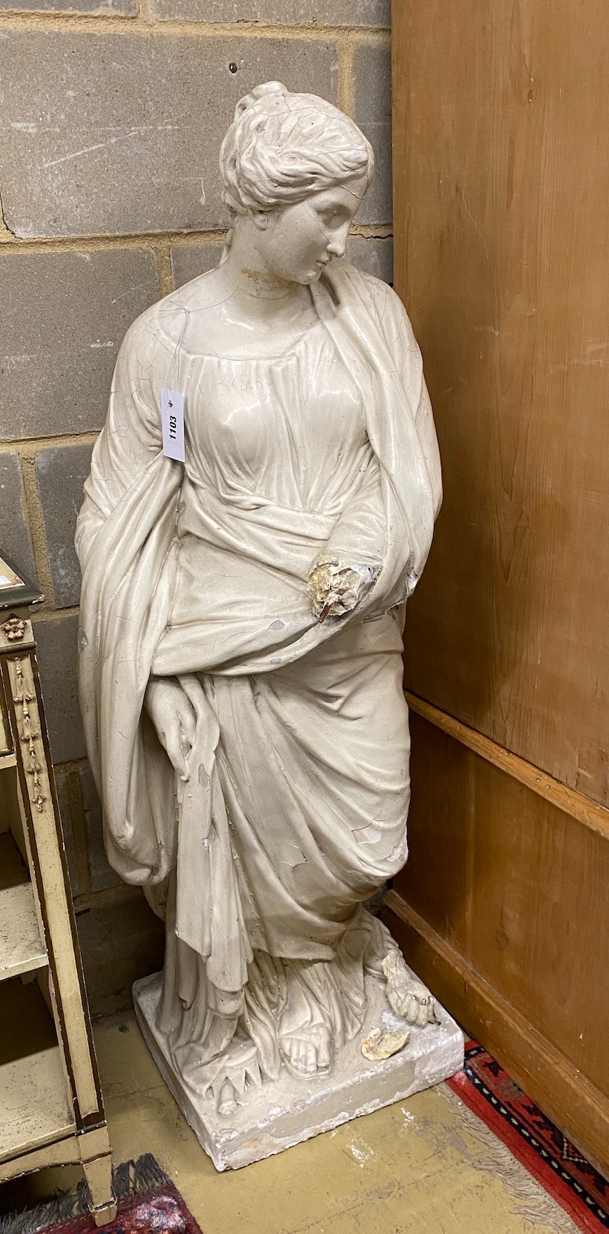 After the antique. A painted plaster figure of a classical woman (a.f.), height 127cm                                                                                                                                       