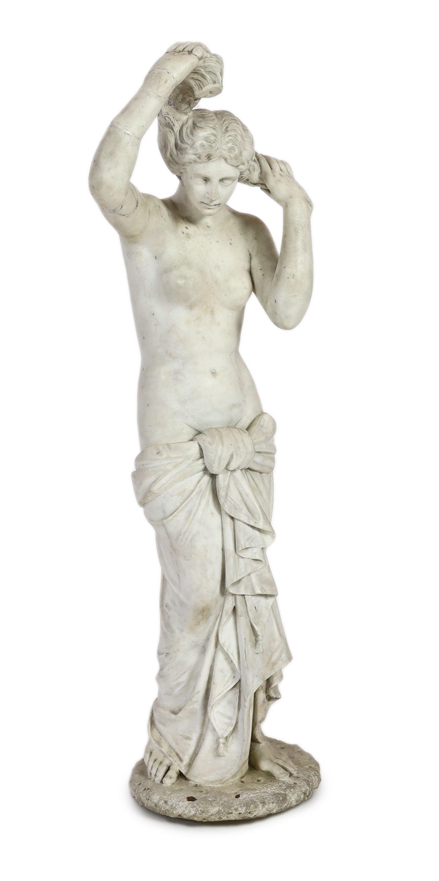 After the Antique. A late 19th century Italian carved white marble figure of Venus Anadyomene                                                                                                                               