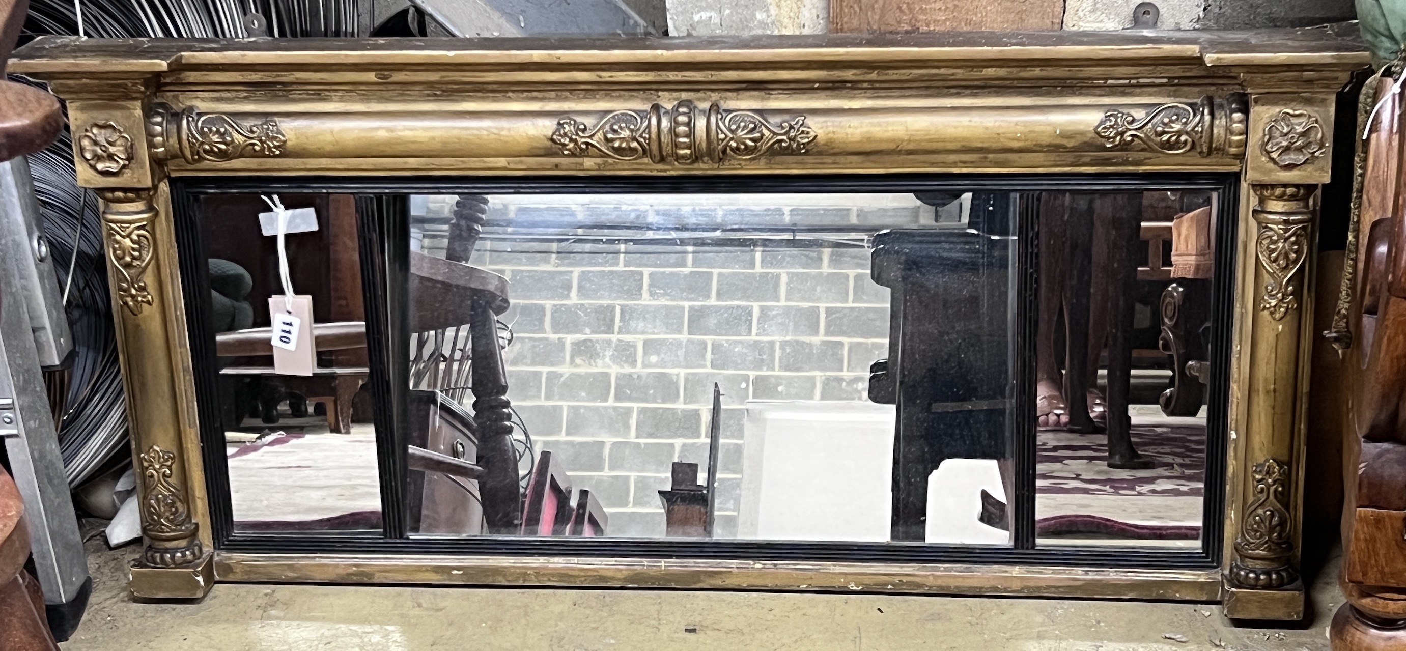 A Regency giltwood and gesso triple plate overmantel mirror, width 111cm, height 50cm                                                                                                                                       