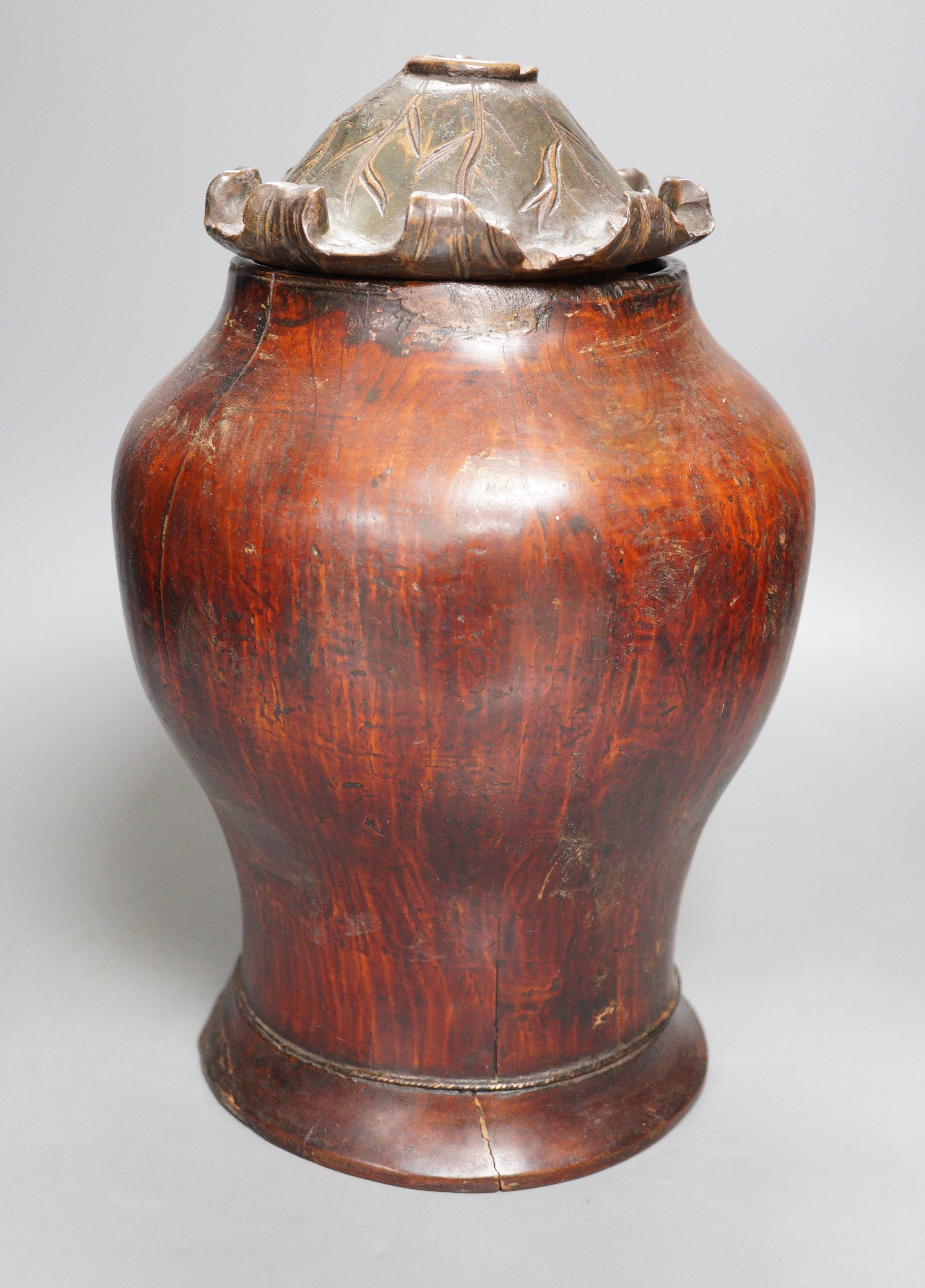 A Chinese carved wood jar and cover, 33cm                                                                                                                                                                                   