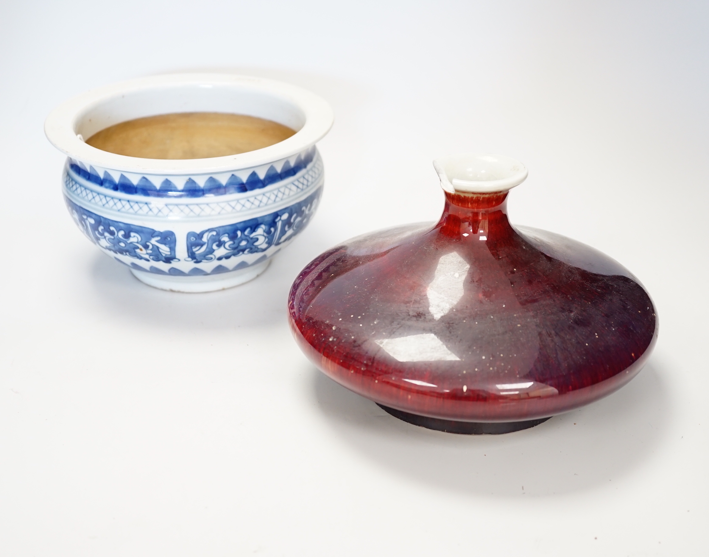 A Chinese blue and white bowl and flambe vase with four character mark to base. Vase 20cm wide                                                                                                                              