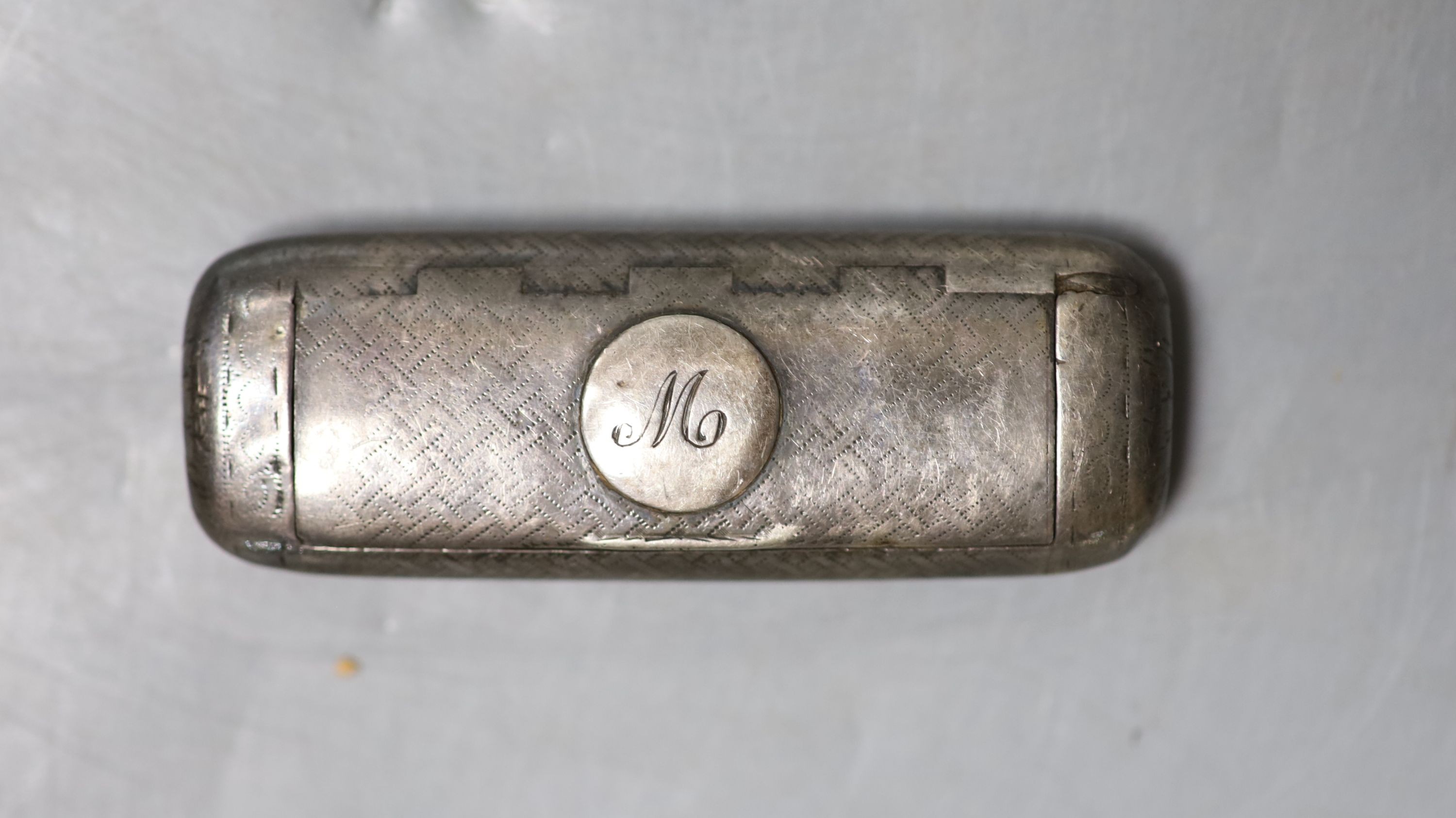 A George III engraved silver shaped rectangular vinaigrette?, London, 1806, no maker's mark or grille, 7cm (tired).                                                                                                         