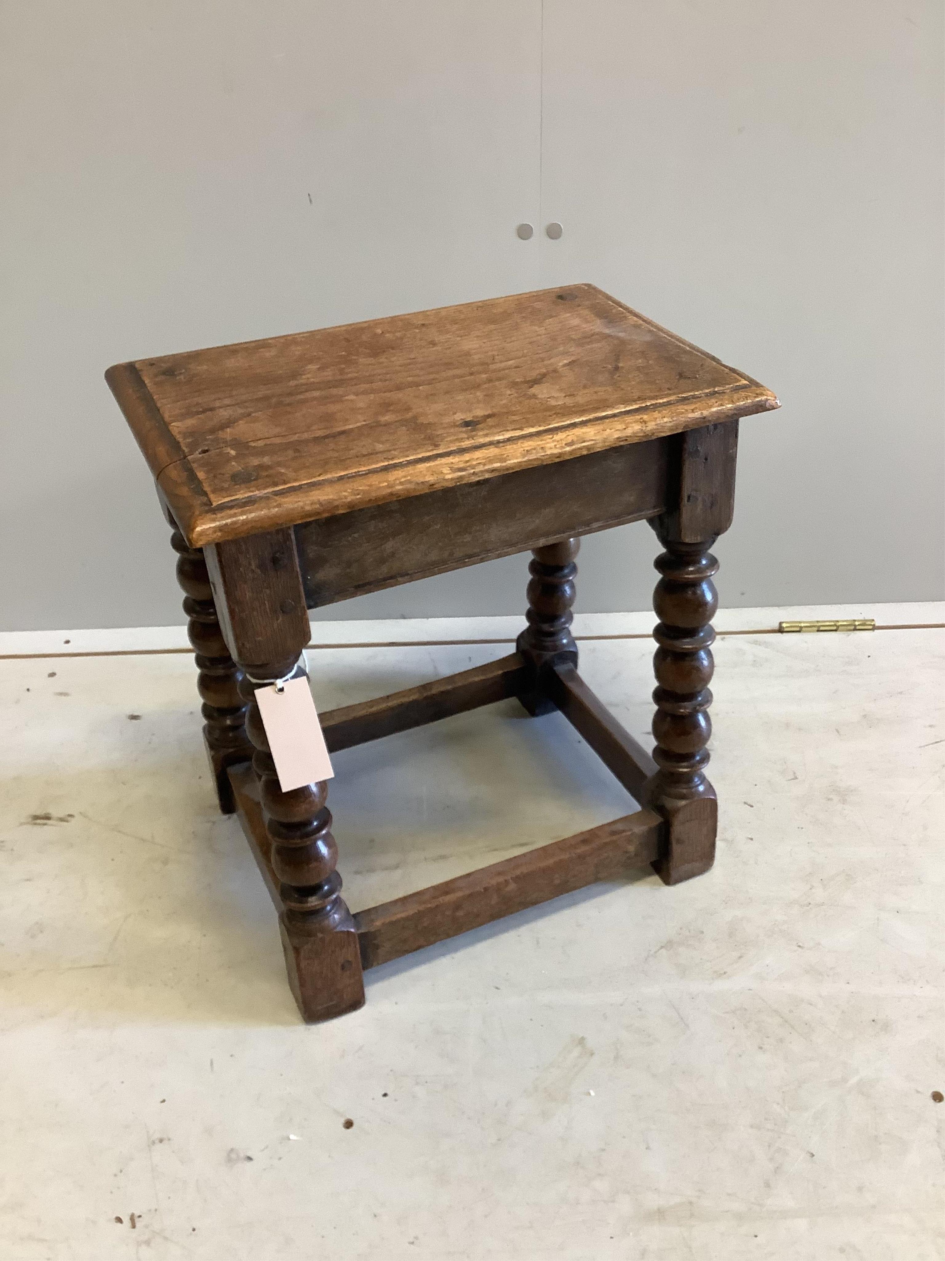 An 18th century style rectangular oak joint stool, width 42cm, depth 27cm, height 46cm. Condition - poor to fair                                                                                                            