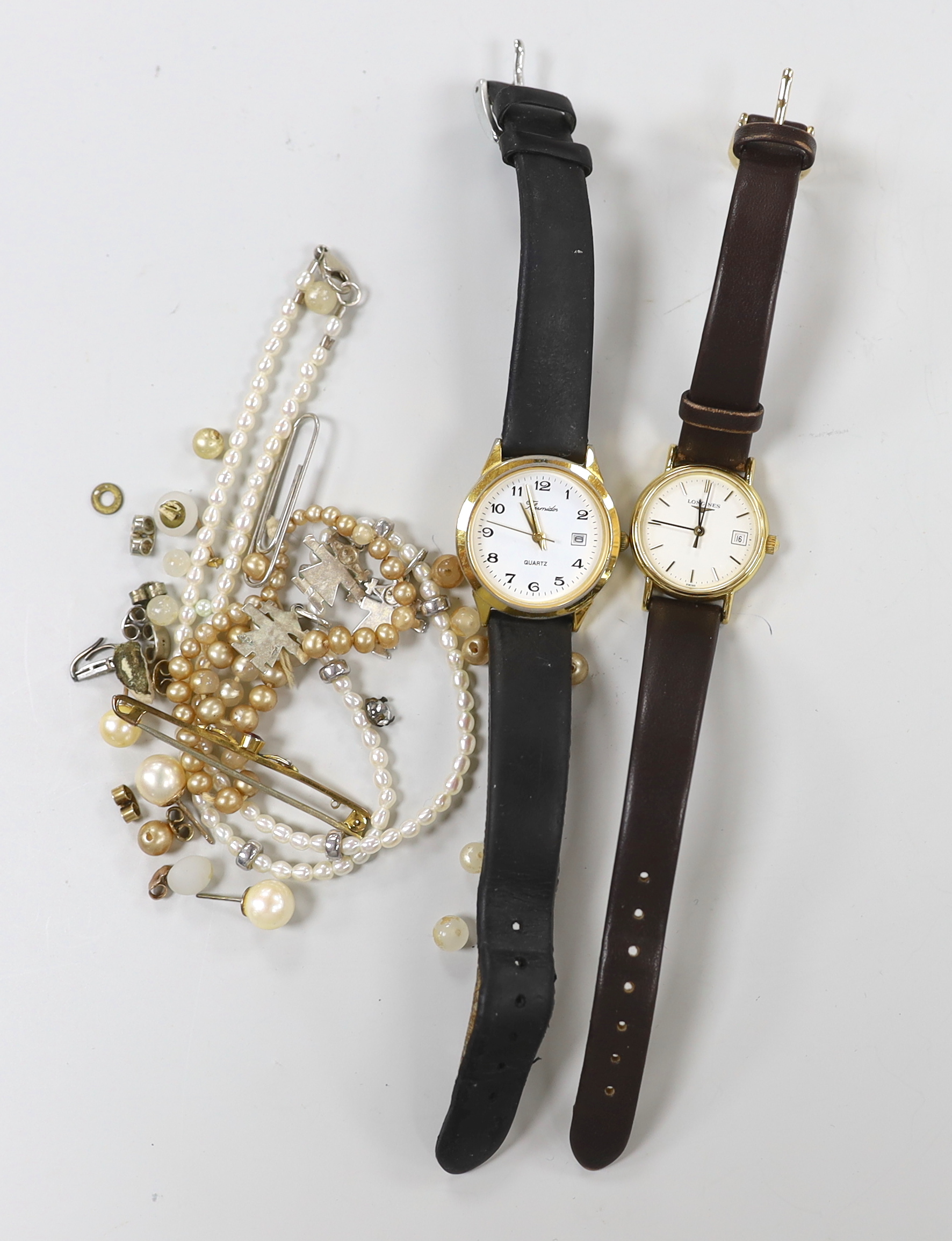 A lady's steel and gold plated Longines quartz wrist watch, one other watch, a 9ct and gem set bar brooch and sundry minor jewellery.                                                                                       