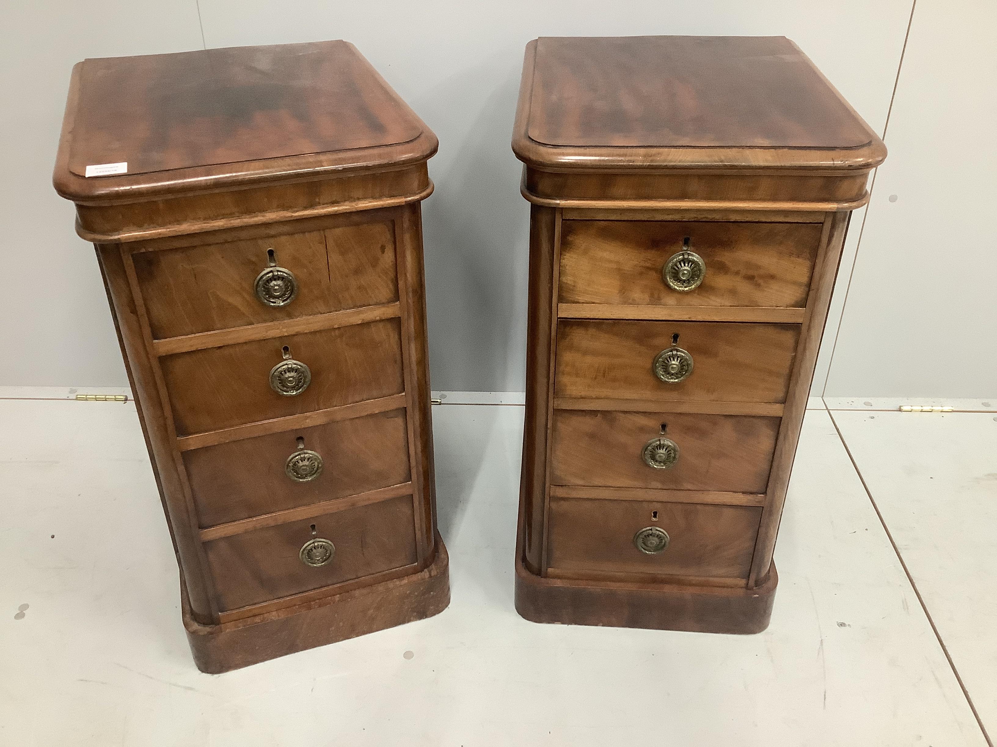 A pair of Victorian mahogany bedside cabinets with dummy drawer fronts, adapted, width 42cm, depth 53cm, height 78cm                                                                                                        