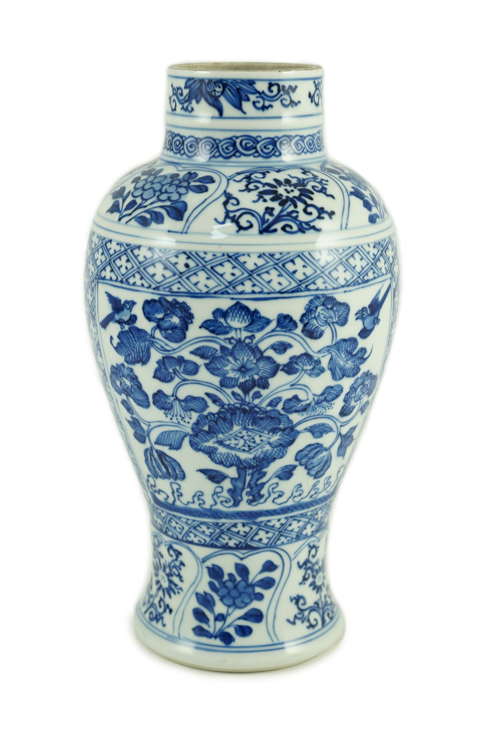 A Chinese blue and white vase, Kangxi period, 21cm high, hairline crack to neck                                                                                                                                             