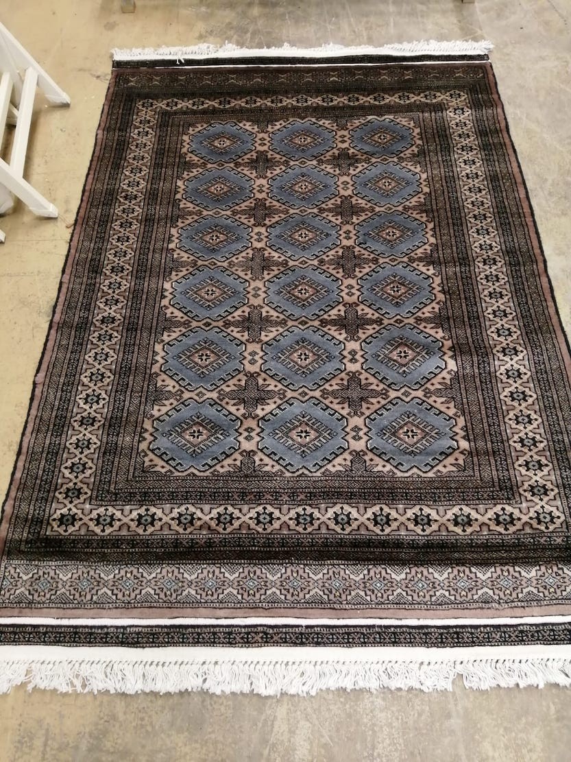 A Karachi blue-brown rug, 180 x 125cm                                                                                                                                                                                       