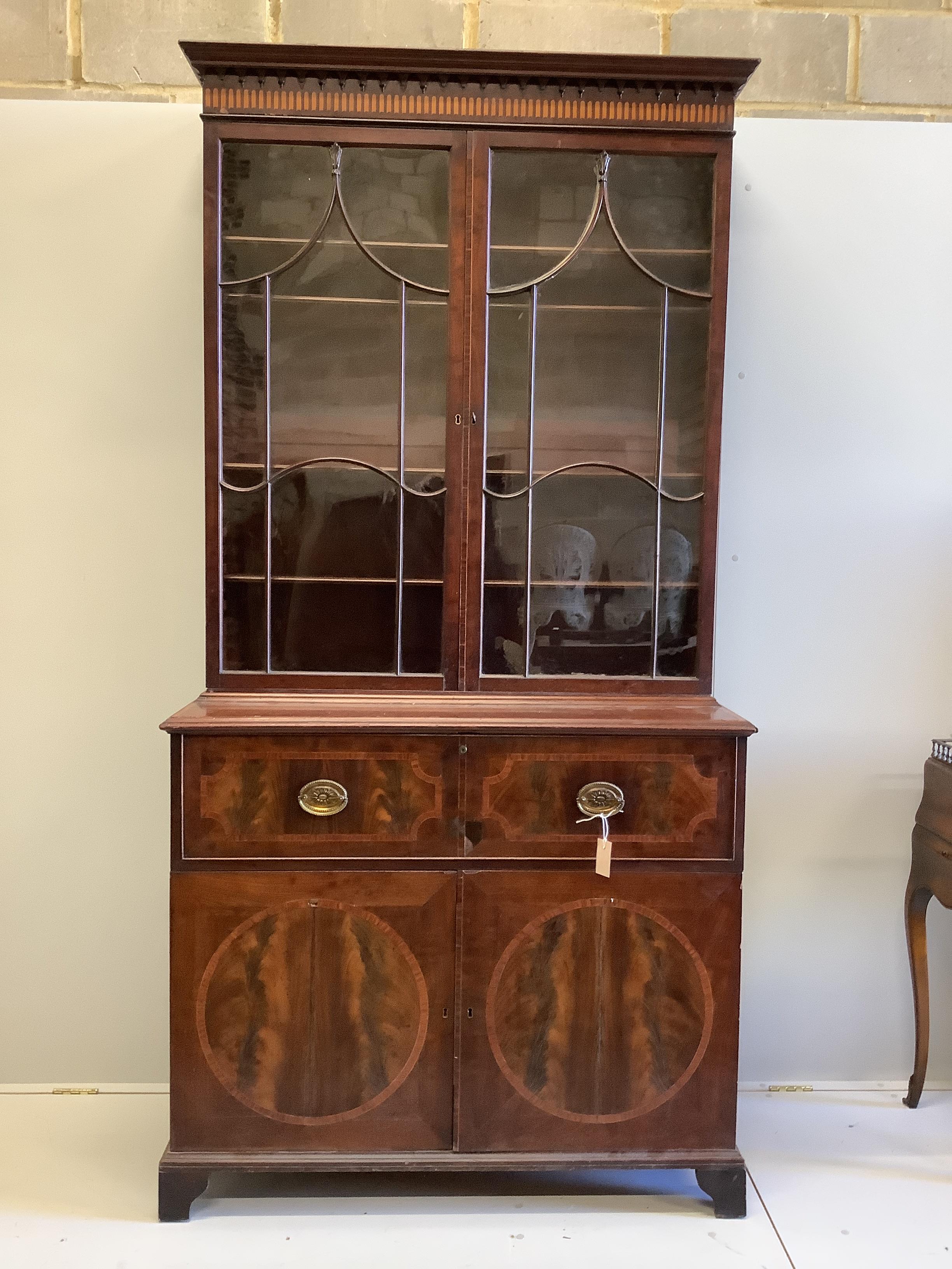 A George III satinwood banded mahogany secretaire bookcase, width 117cm, depth 58cm, height 236cm (a.f.)                                                                                                                    