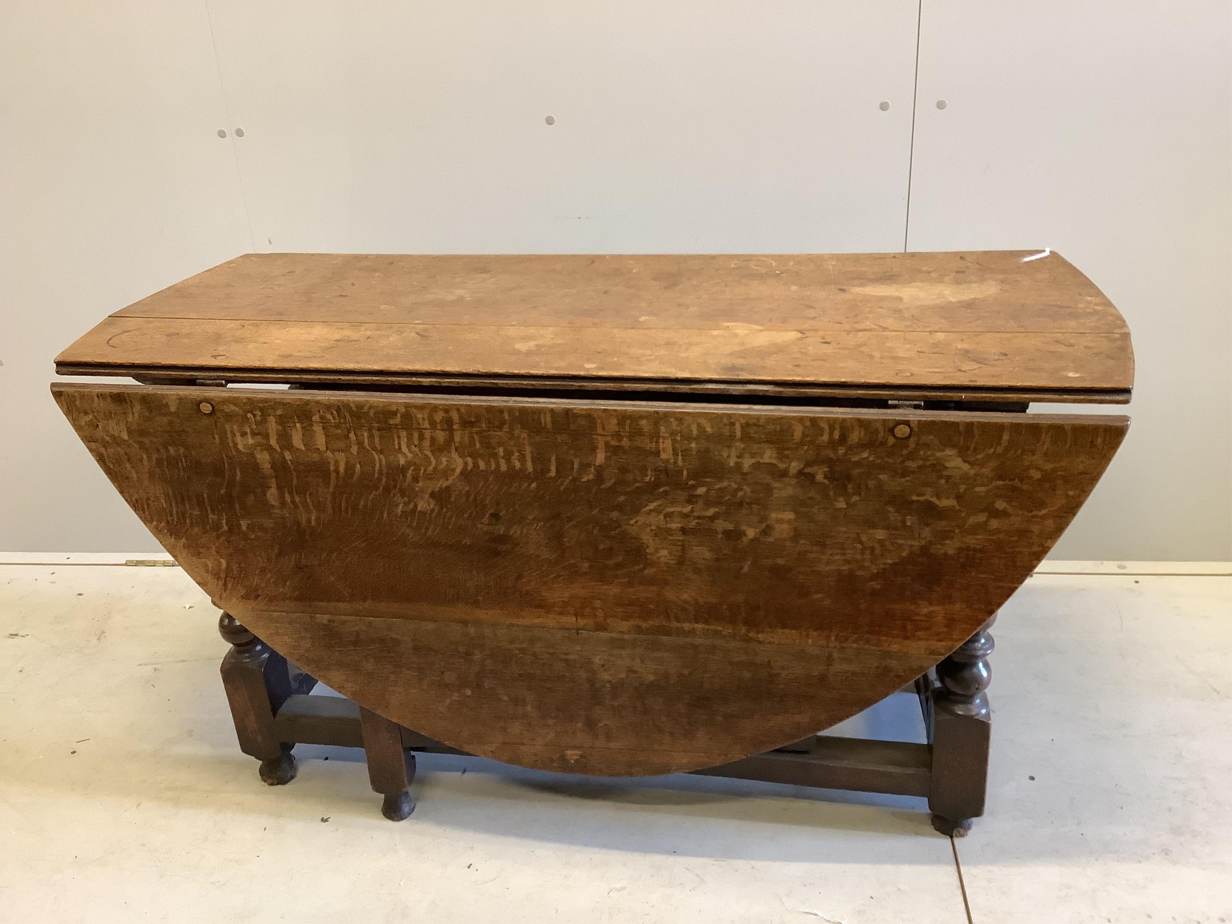 An 18th century oak gateleg table, width 135cm, depth 55cm, height 73cm. Condition - poor to fair                                                                                                                           