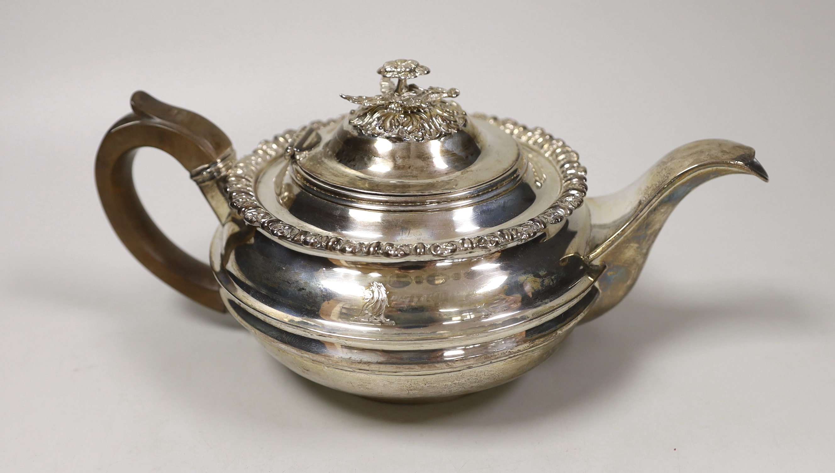 A George III silver squat circular teapot, George Burrows II, London, 1816, gross weight 20.6oz.                                                                                                                            