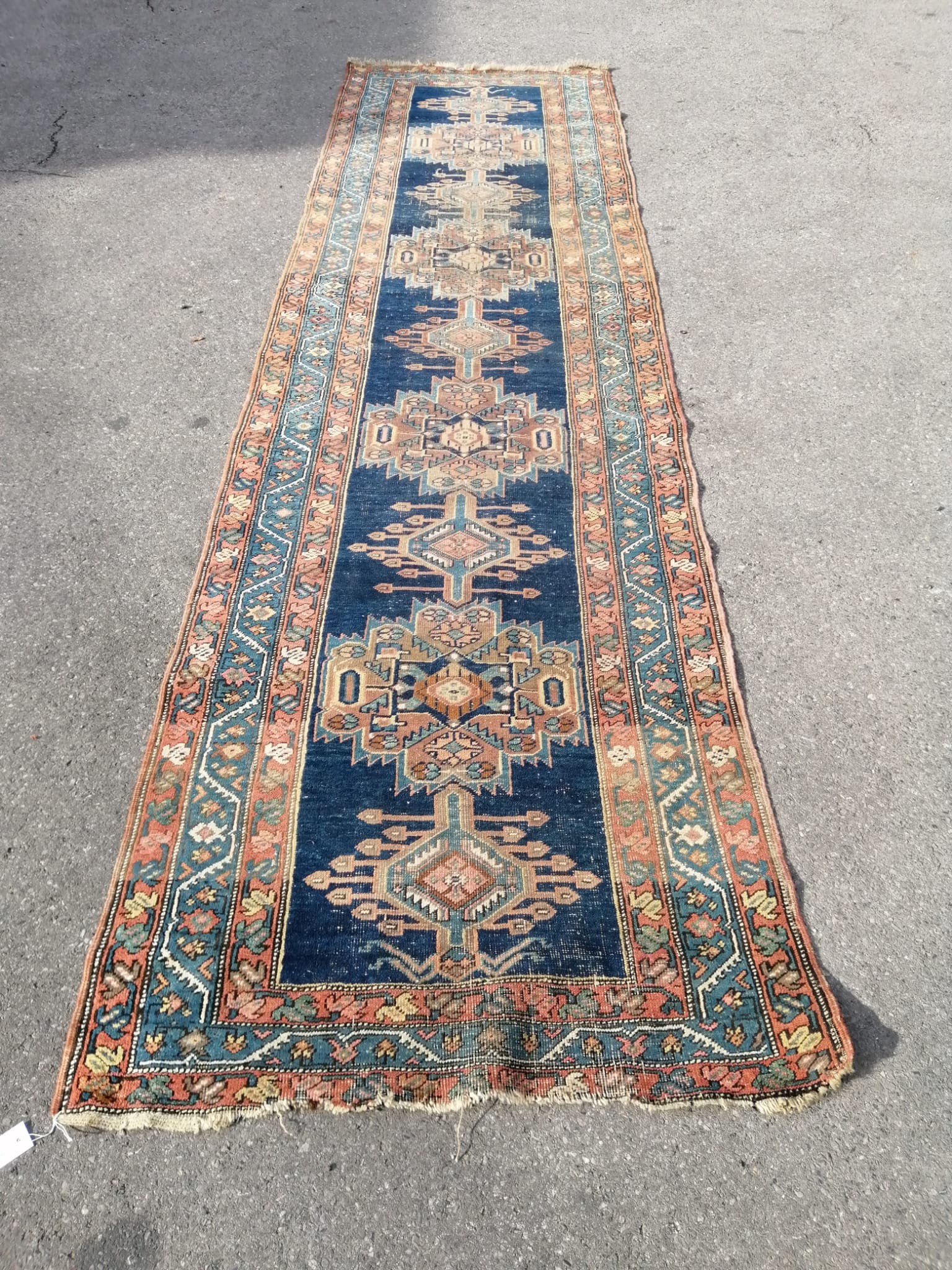 A North West Persian blue ground runner, (heavily worn) 404 x 101cm                                                                                                                                                         