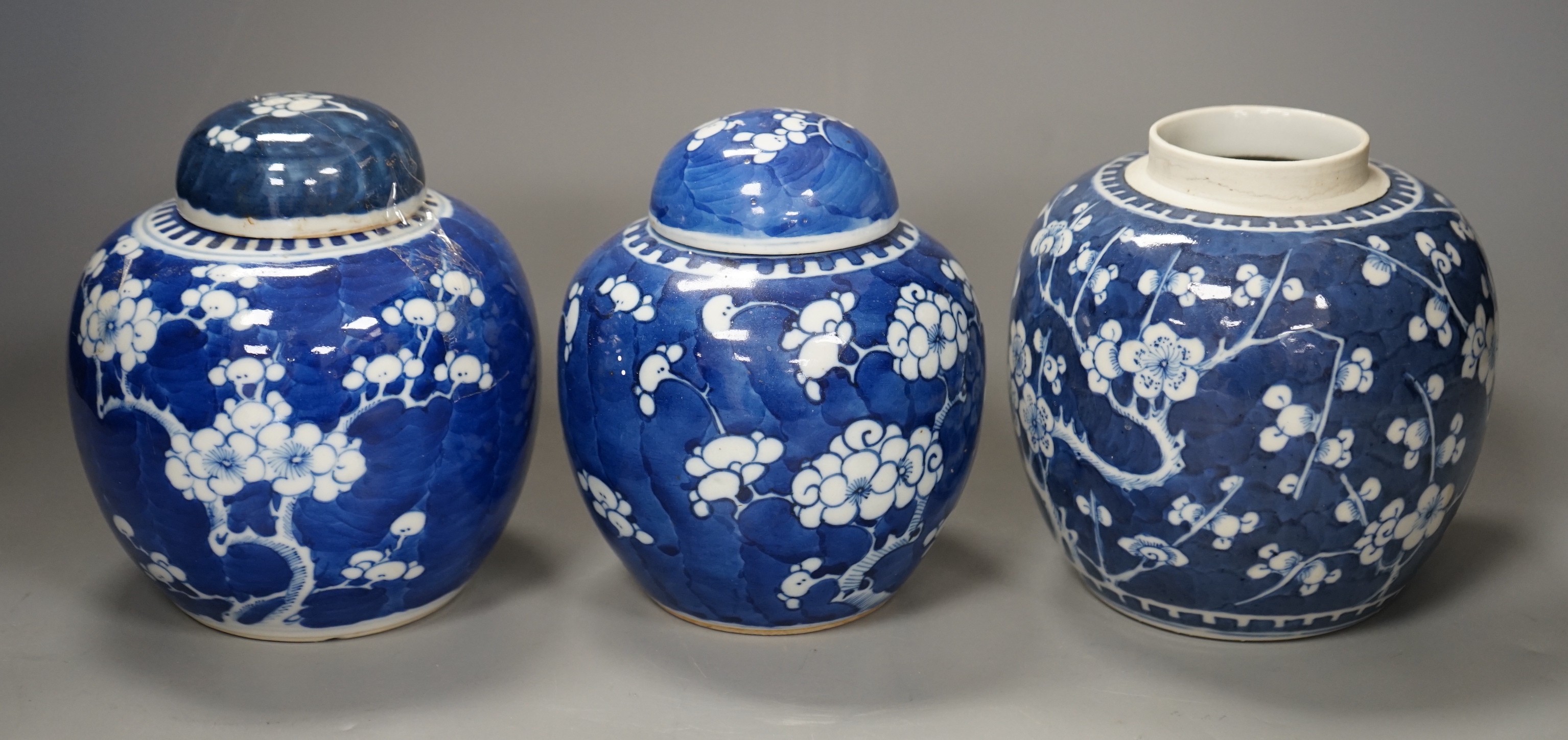 Three 19th century Chinese blue and white 'prunus' jars and two covers, 15cm                                                                                                                                                