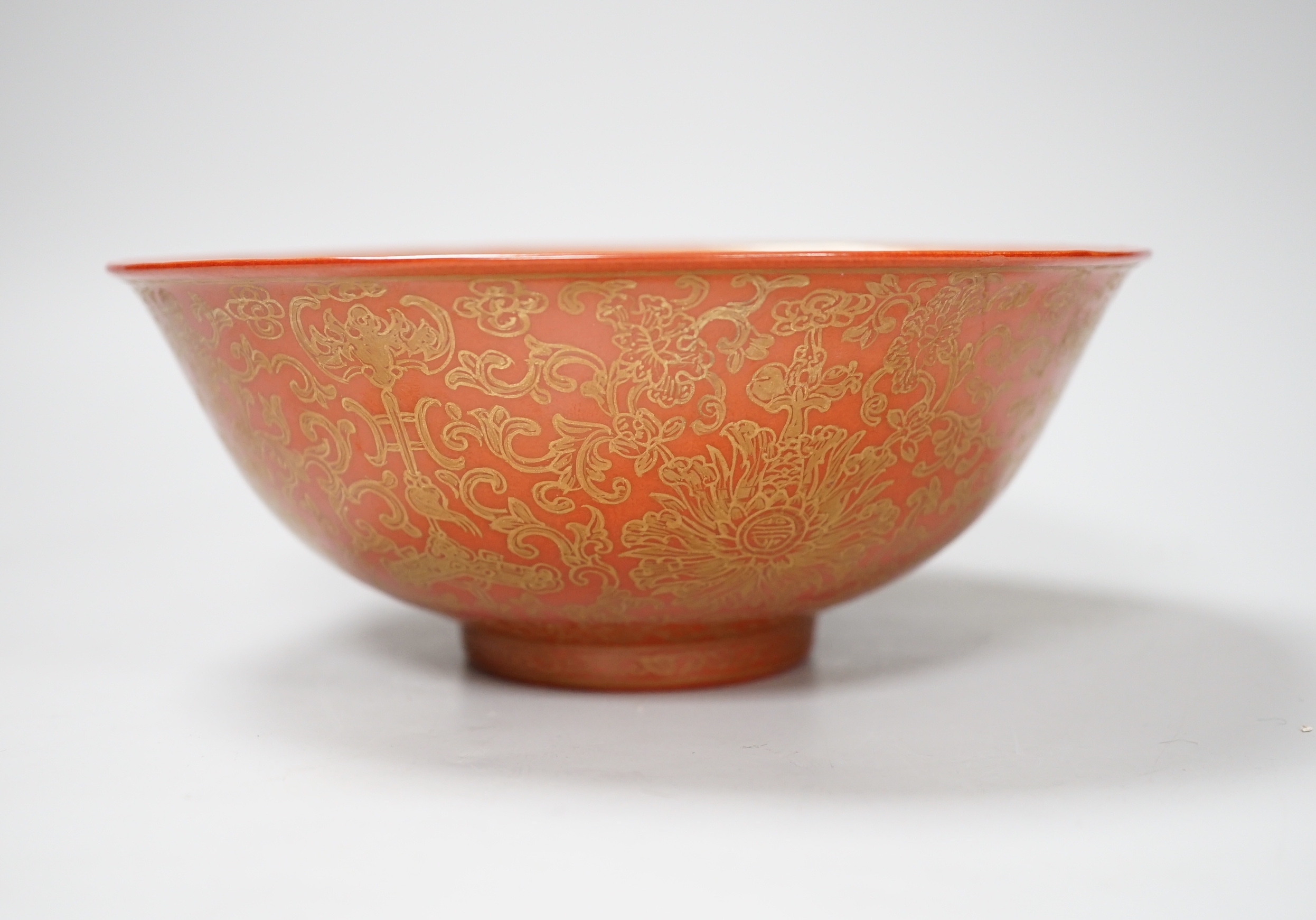 A Chinese gilded coral-ground bowl, 17cm diameter                                                                                                                                                                           