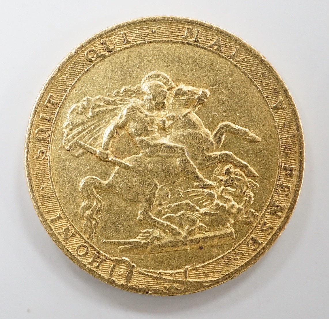 A George III 1817 gold sovereign, about VF.                                                                                                                                                                                 