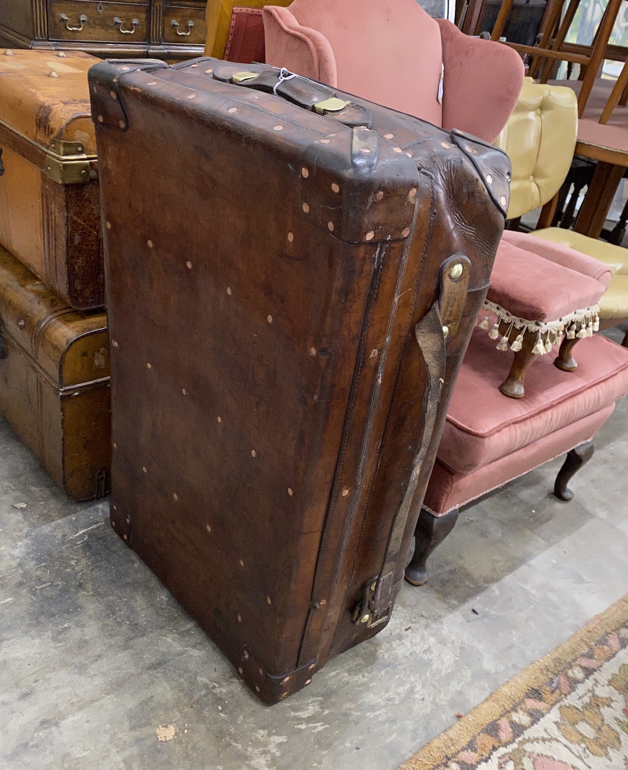 A Victorian leather copper and brass studded travelling trunk, length 94cm, depth 56cm, height 30cm                                                                                                                         