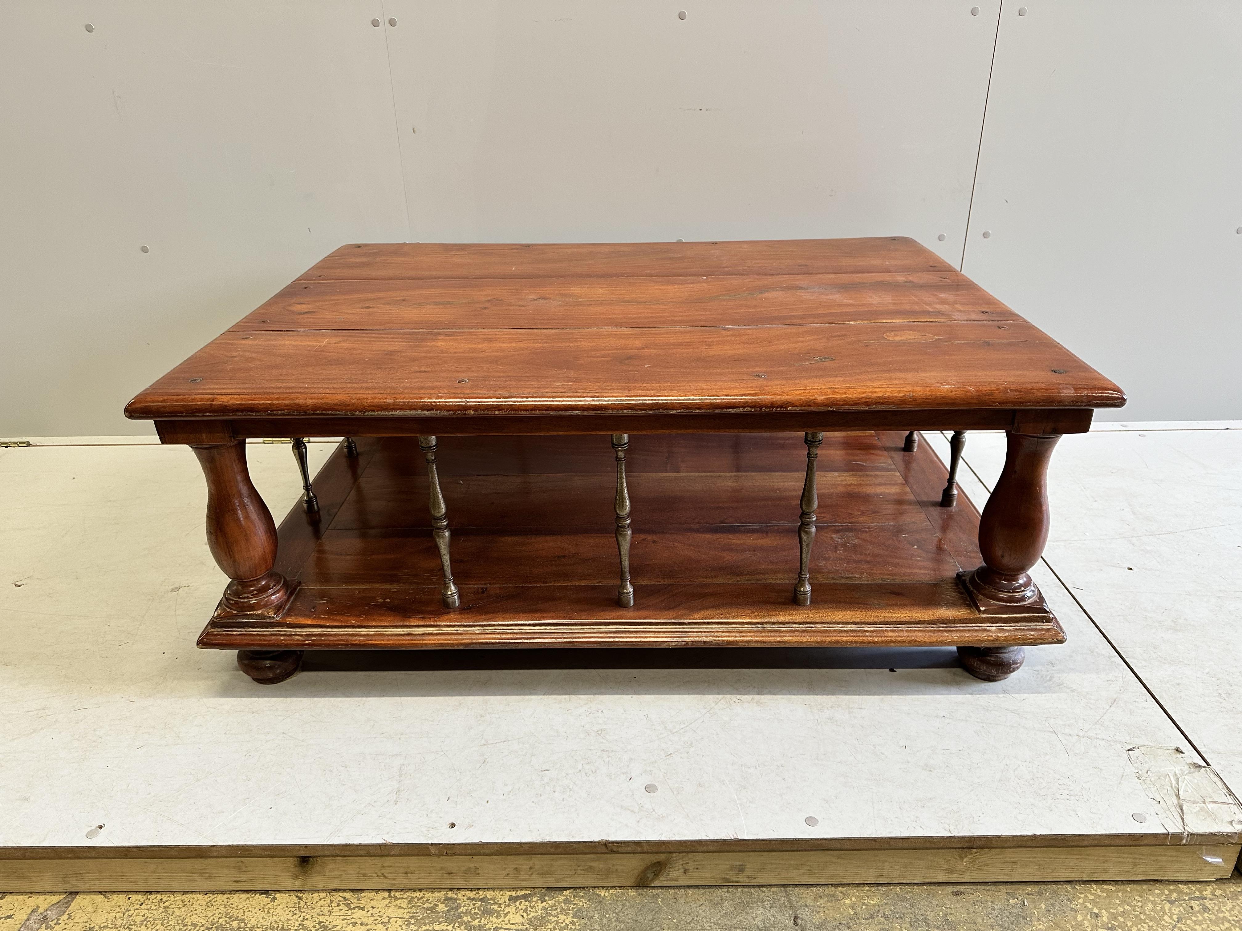 A rectangular brass mounted mahogany two tier coffee table, width 122cm, depth 91cm, height 48cm                                                                                                                            