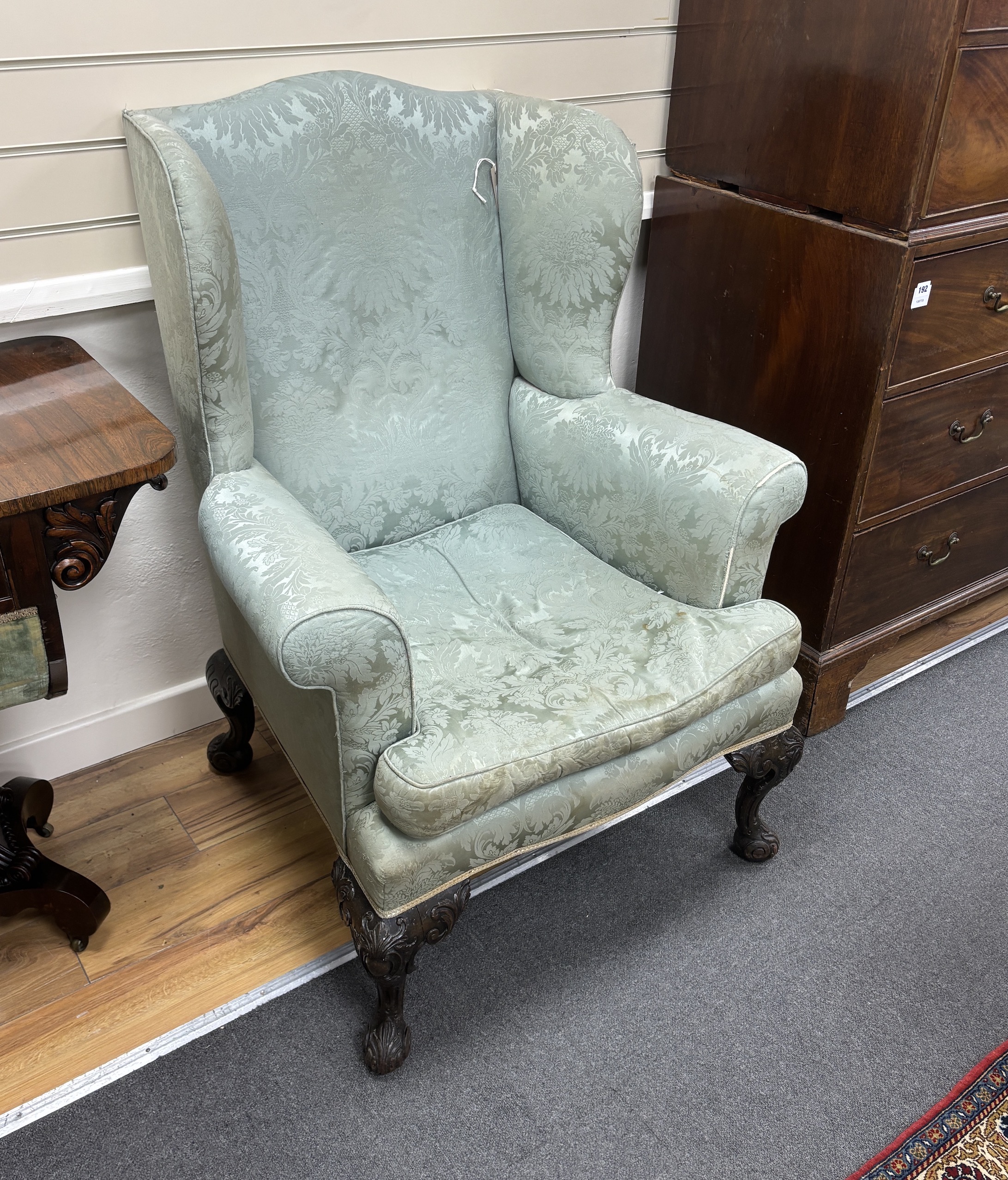 An early 20th century George III style upholstered wing armchair, width 82cm, depth 74cm, height 110cm                                                                                                                      