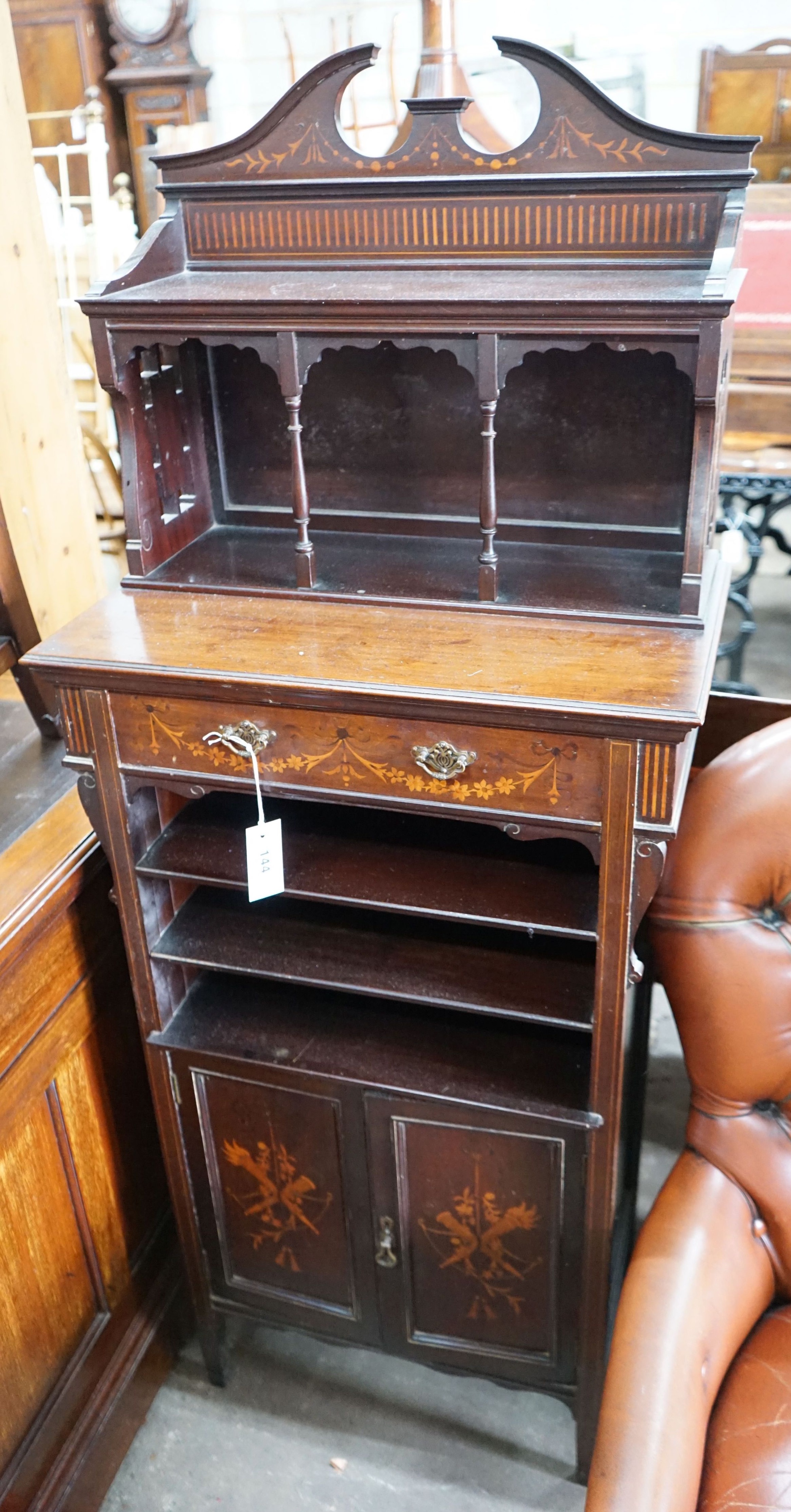 An Edwardian marquetry inlaid mahogany side cabinet, with galleried top, open shelves and a pair of cupboard doors, width 58cm, depth 35cm, height 145cm                                                                    