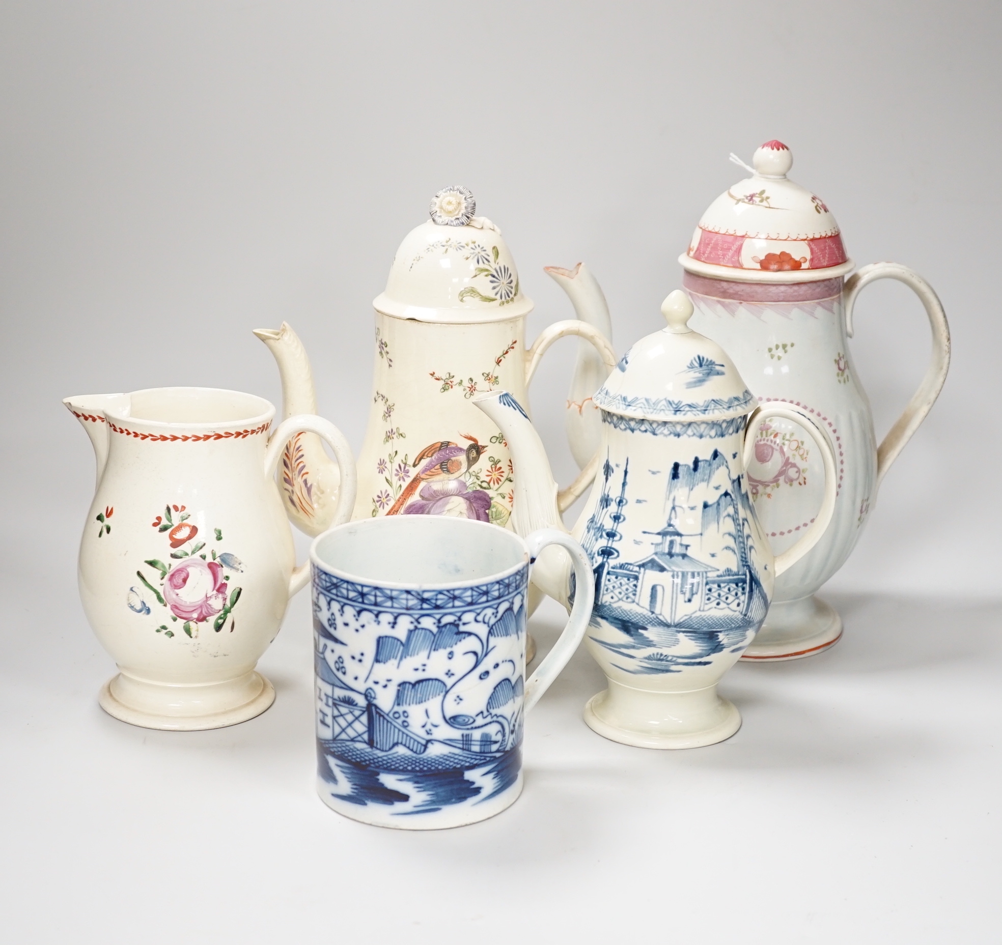 Three Georgian creamware and pearlware teapots, a jug and a mug, tallest 27cm                                                                                                                                               