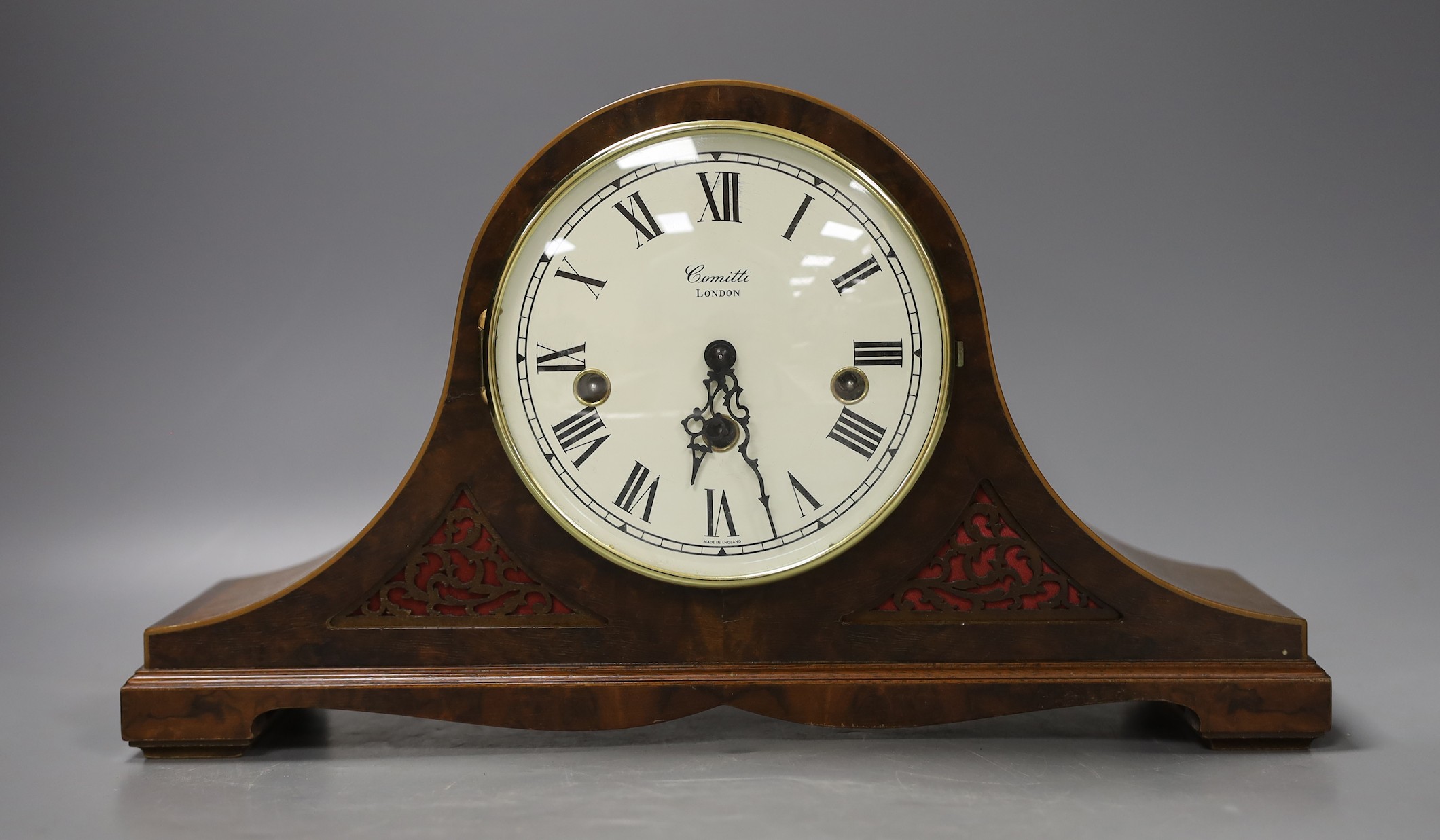 A Comitti mahogany ‘Napoleon hat’ mantel clock - 38cm wide                                                                                                                                                                  