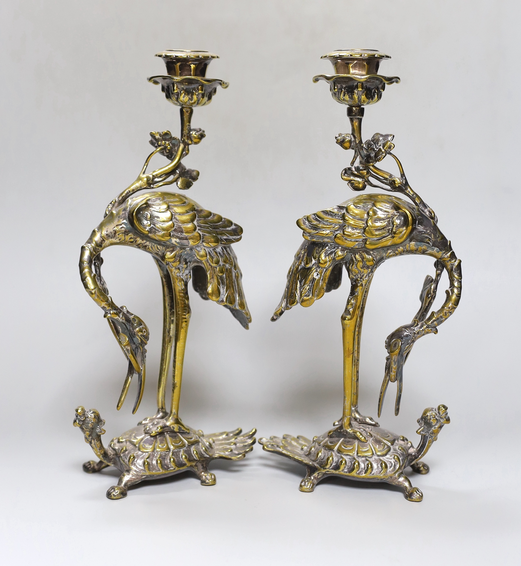 A pair of early 20th century Japanese style silver plated brass ‘crane’ candlesticks                                                                                                                                        