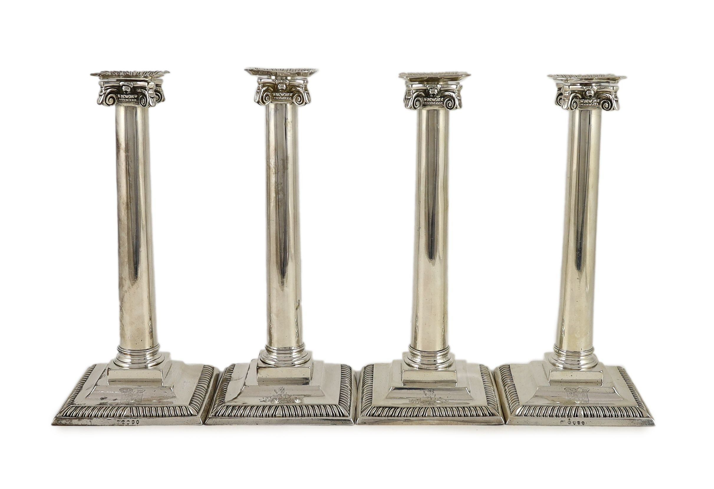 A set of three George III Corinthian silver ionic column candlesticks, by Thomas Shephard? London, 1795 and one other matched candlestick, Smith & Sharp, London, 1786                                                      