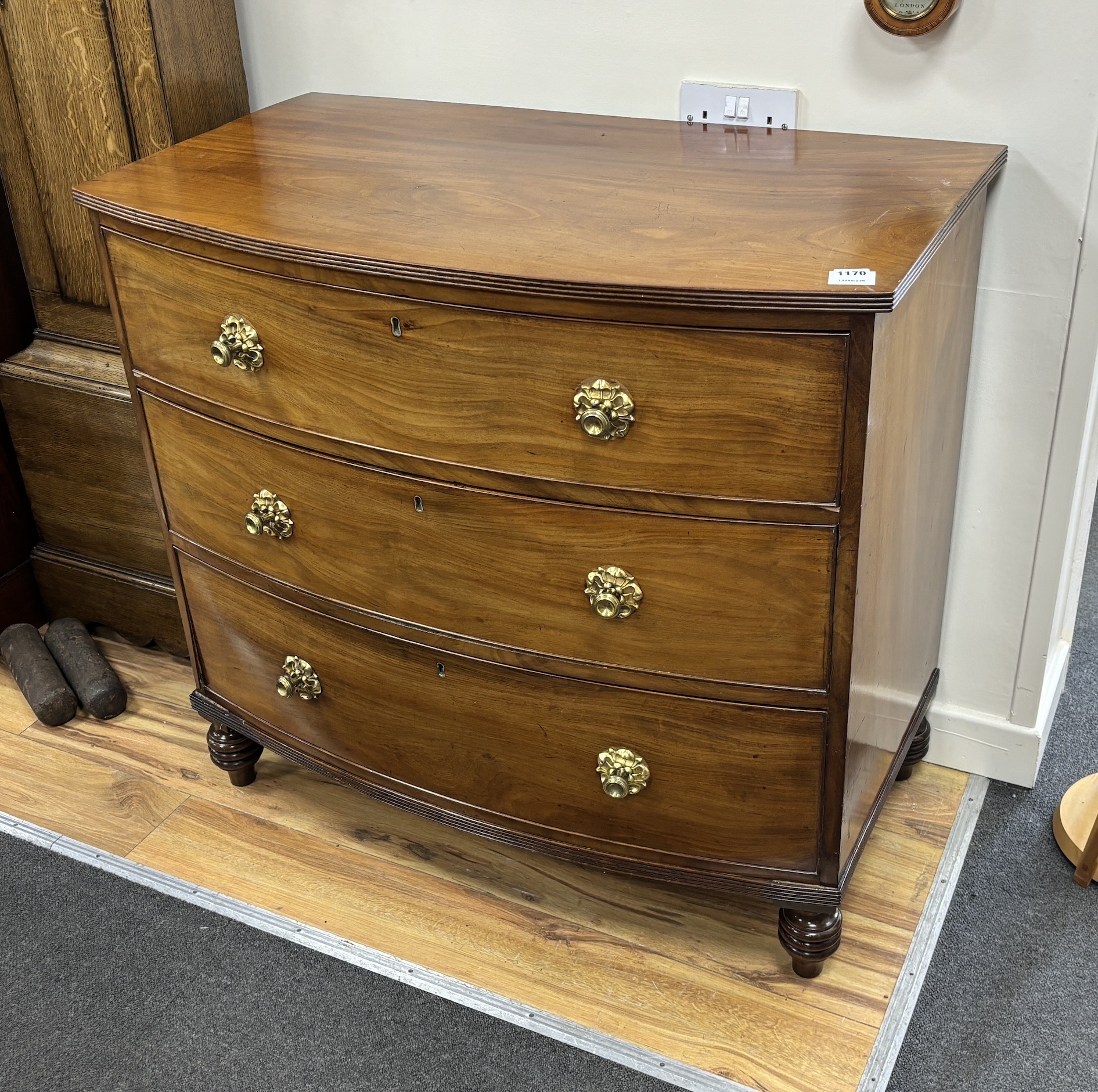 A Regency mahogany bowfront chest of three long drawers, width 94cm, depth 54cm, height 87cm                                                                                                                                