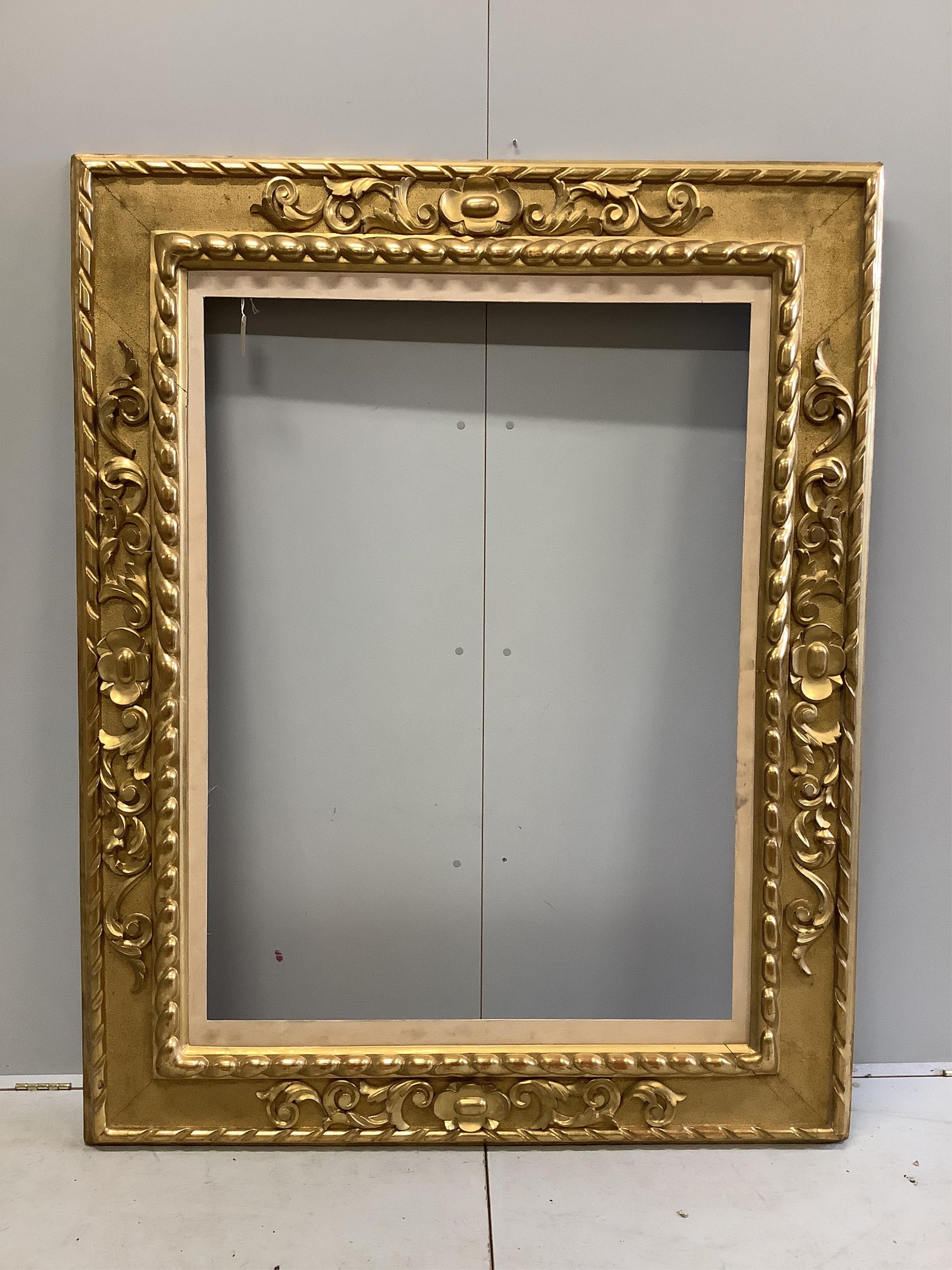 A rectangular giltwood and composition frame, width 142cm, height 180cm. Condition - good                                                                                                                                   