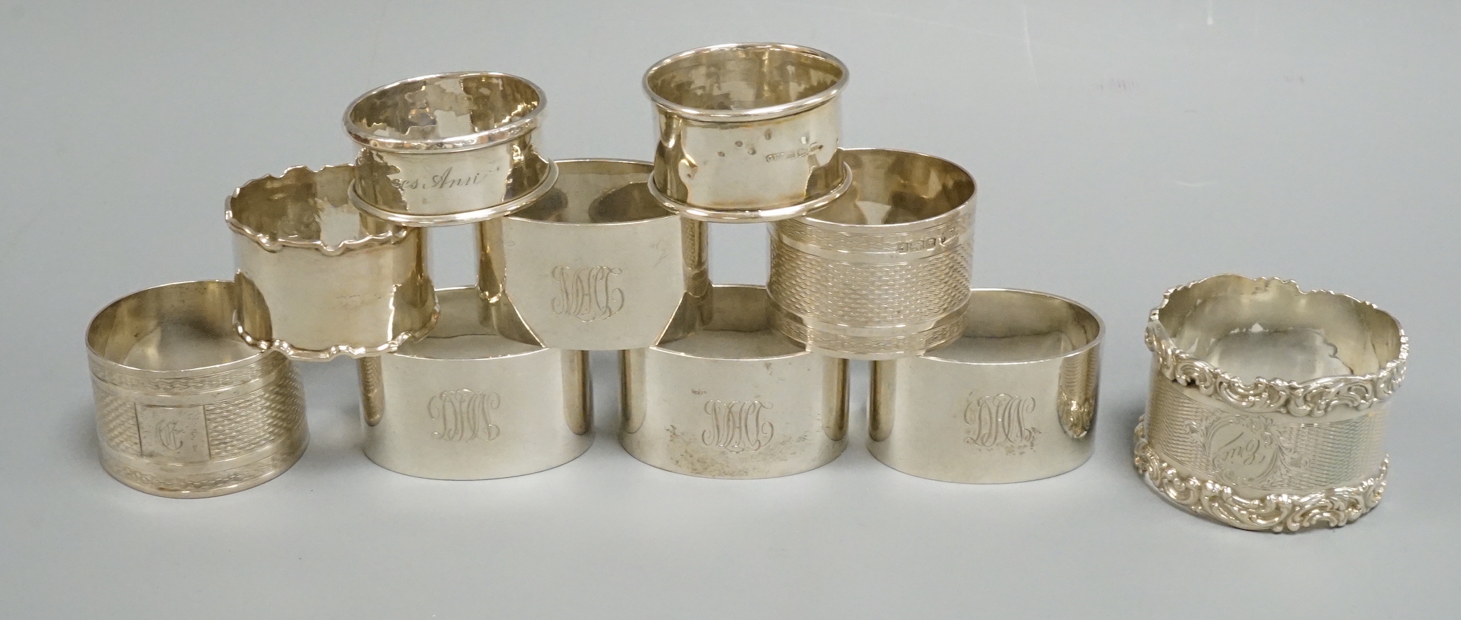 A set of four George V silver oval napkin rings, Mappin & Webb, London, 1925 and six other assorted silver napkin rings.                                                                                                    