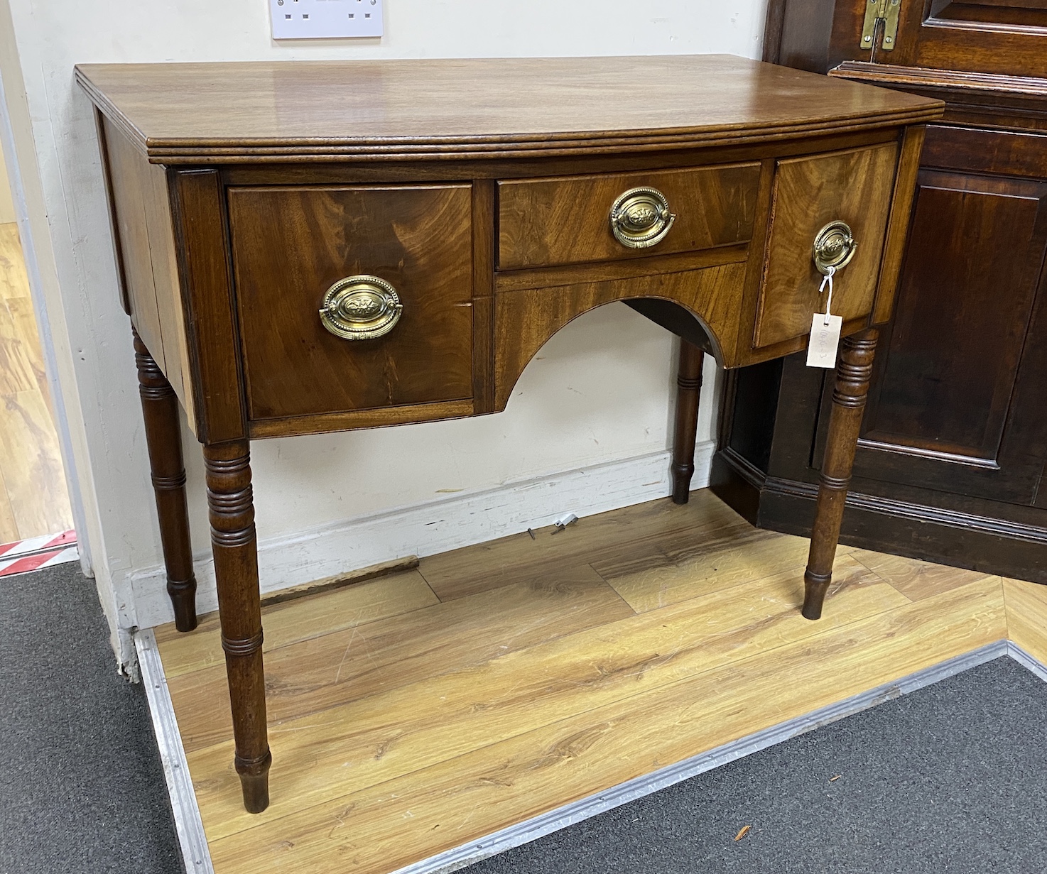 A Regency mahogany bow front three drawer side table, width 95cm, depth 52cm, height 80cm                                                                                                                                   