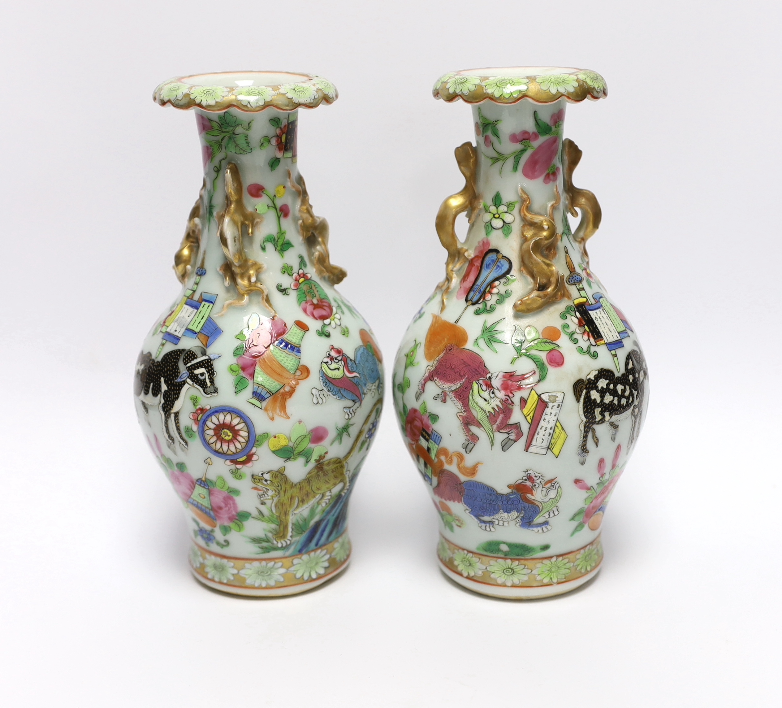 A pair of 19th century Chinese famille rose ‘mythical beasts’ vases, 24cm                                                                                                                                                   