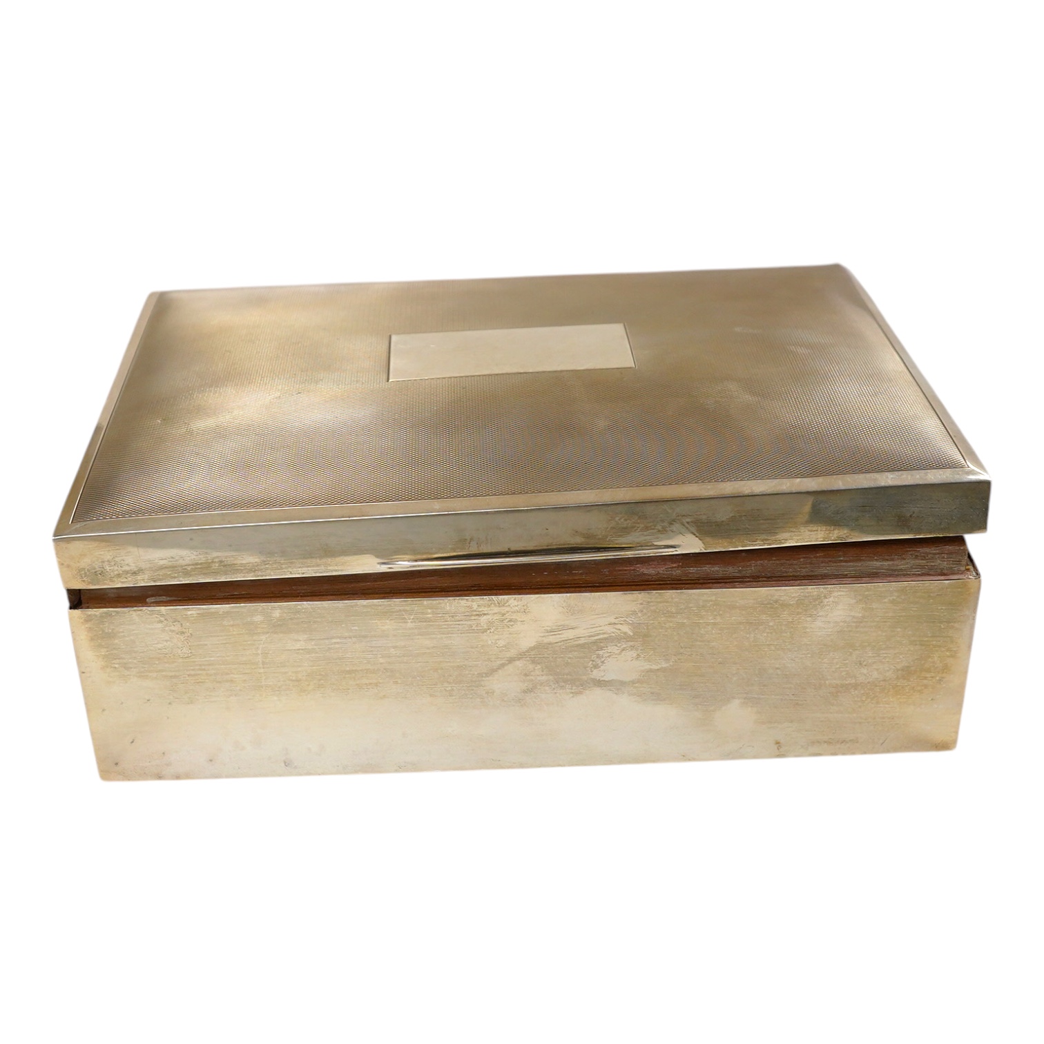 A 1970's silver mounted cigar/cigarette box, Birmingham, 1973, 22.9cm. Condition - poor                                                                                                                                     