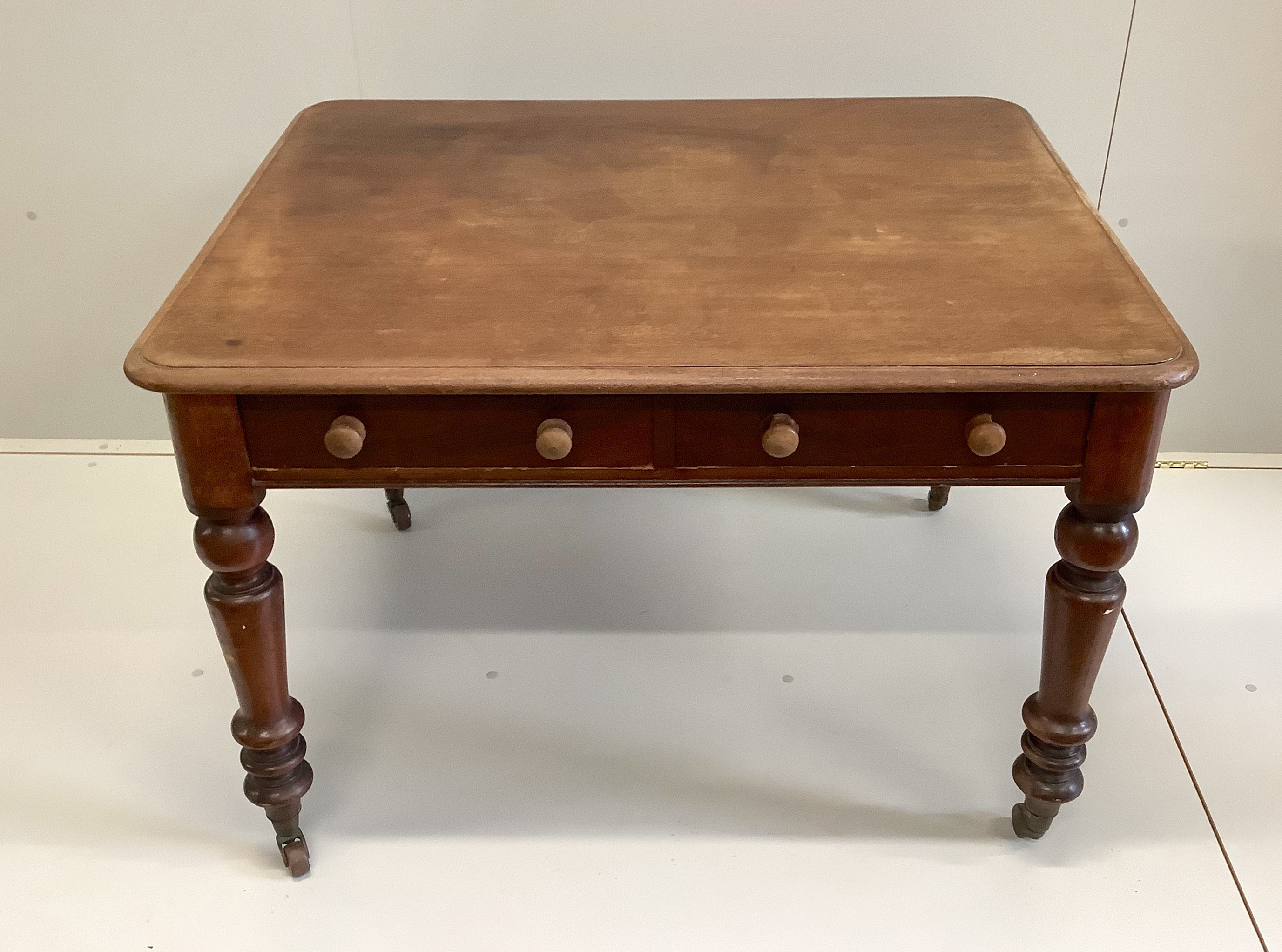 A Victorian mahogany writing table, width 106cm, depth 86cm, height 72cm                                                                                                                                                    