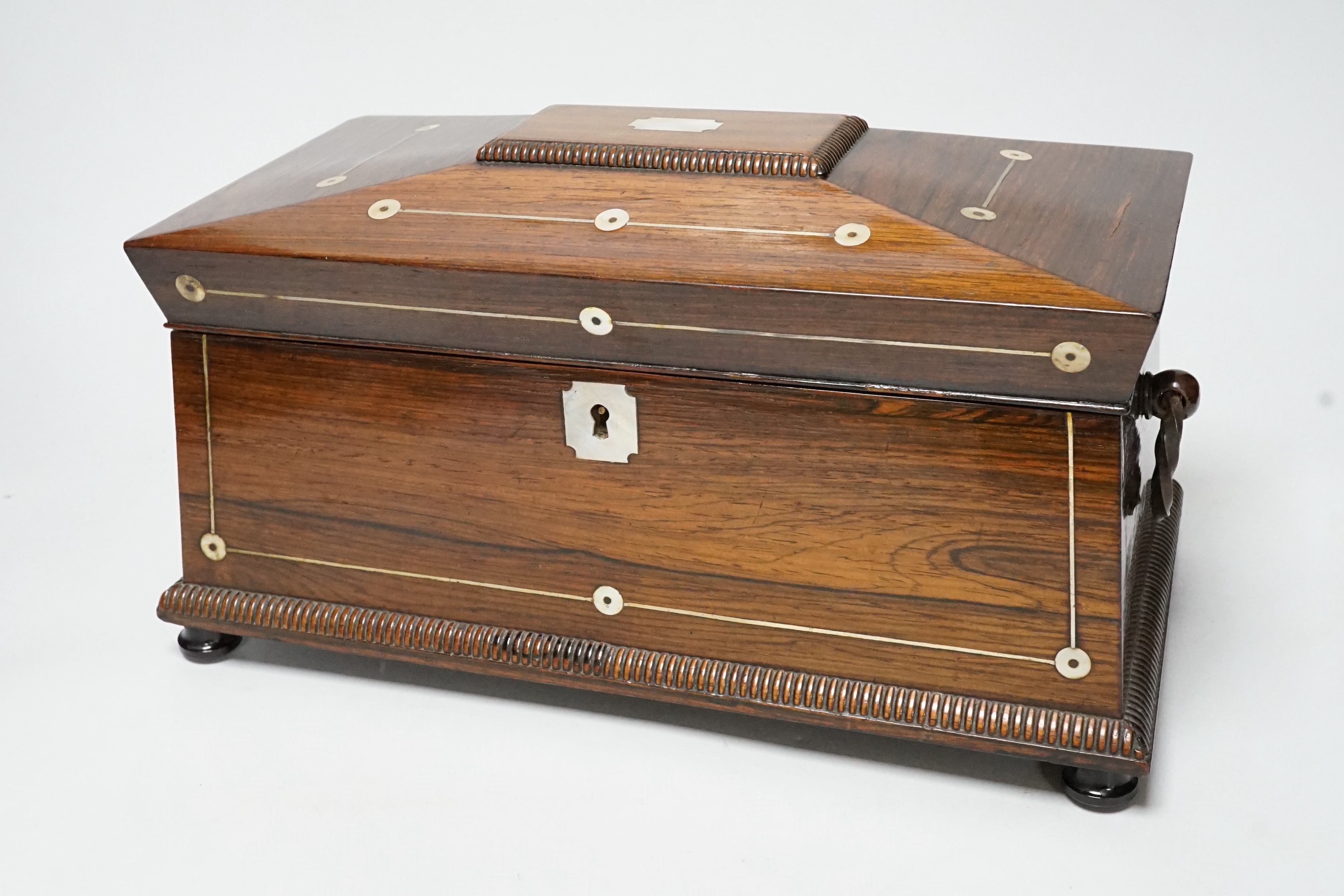 A William IV mother of pearl inlaid rosewood tea caddy, 31cm wide                                                                                                                                                           