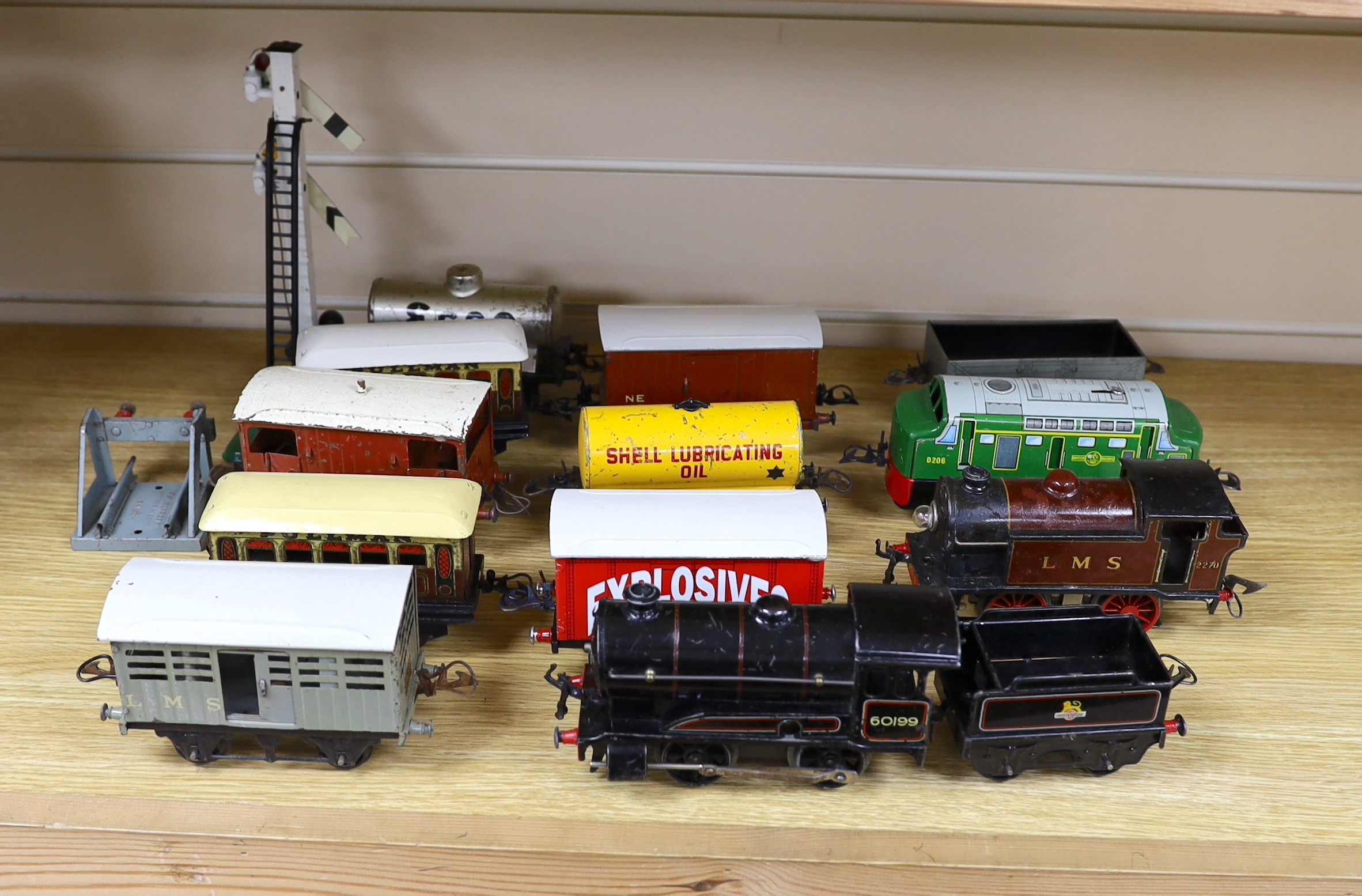 Thirteen Hornby 0 gauge tinplate items including; a clockwork 0-4-0 tender loco, 60199, a 20v electric 0-4-0T loco, 2270, an electric 0-4-0 diesel loco by another maker, marked Made in Great Britain, together with seven 