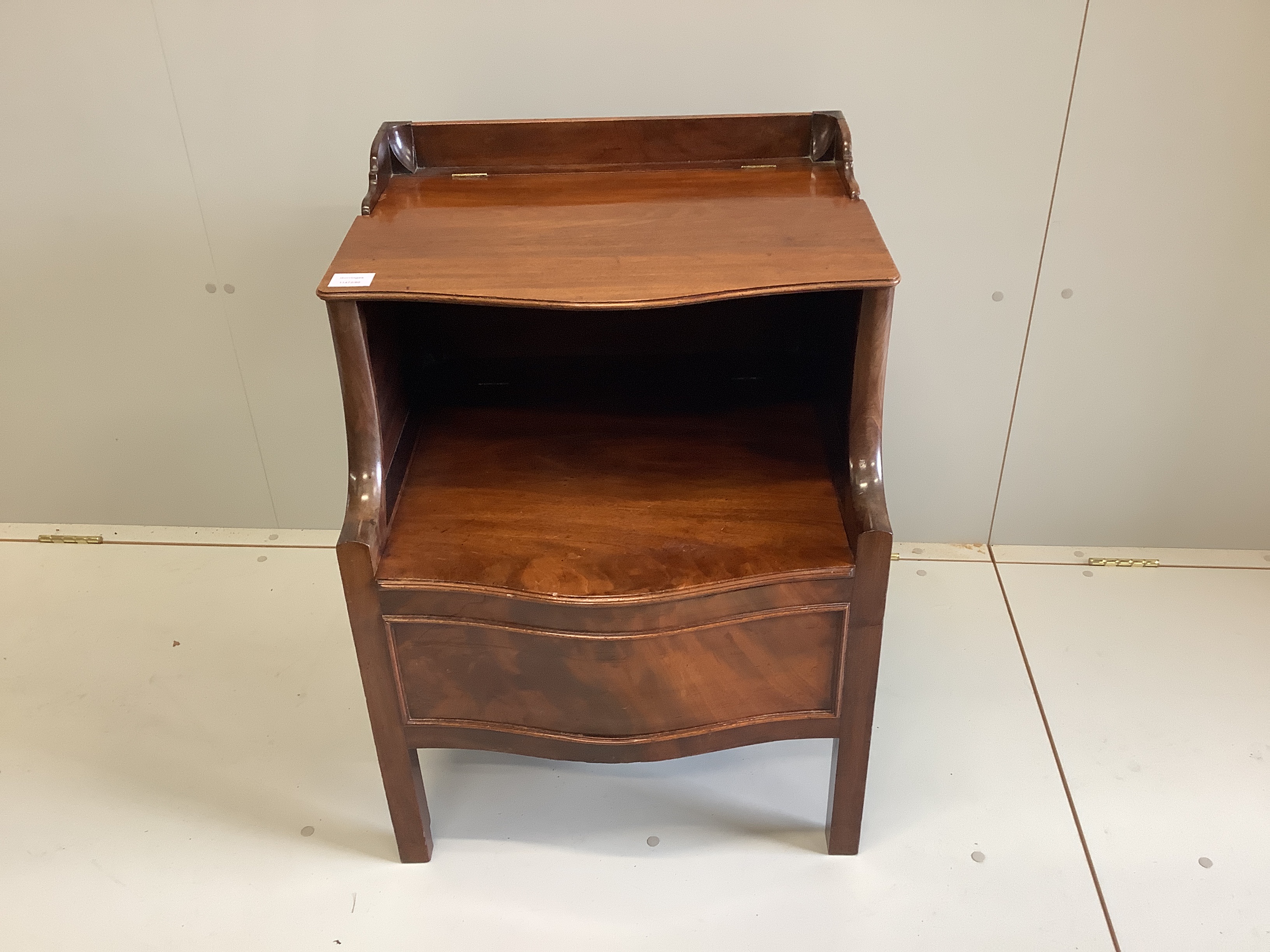A George III mahogany serpentine front commode, width 56cm, depth 52cm, height 75cm                                                                                                                                         
