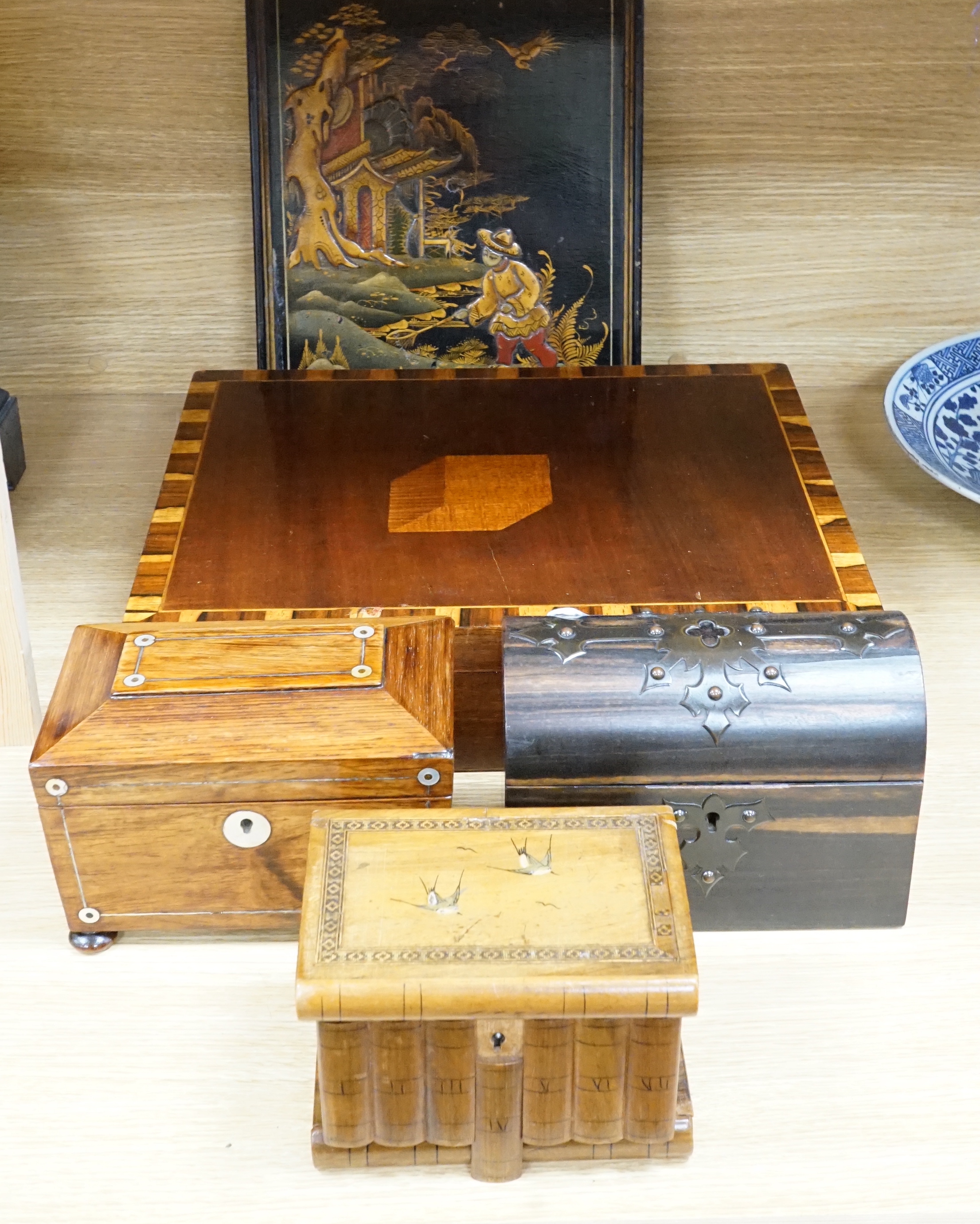 A Victorian coromandel stationary box, a rosewood tea caddy, an olive wood jewellery casket, a mahogany box and a chinoiserie panel, largest 41cm wide                                                                      