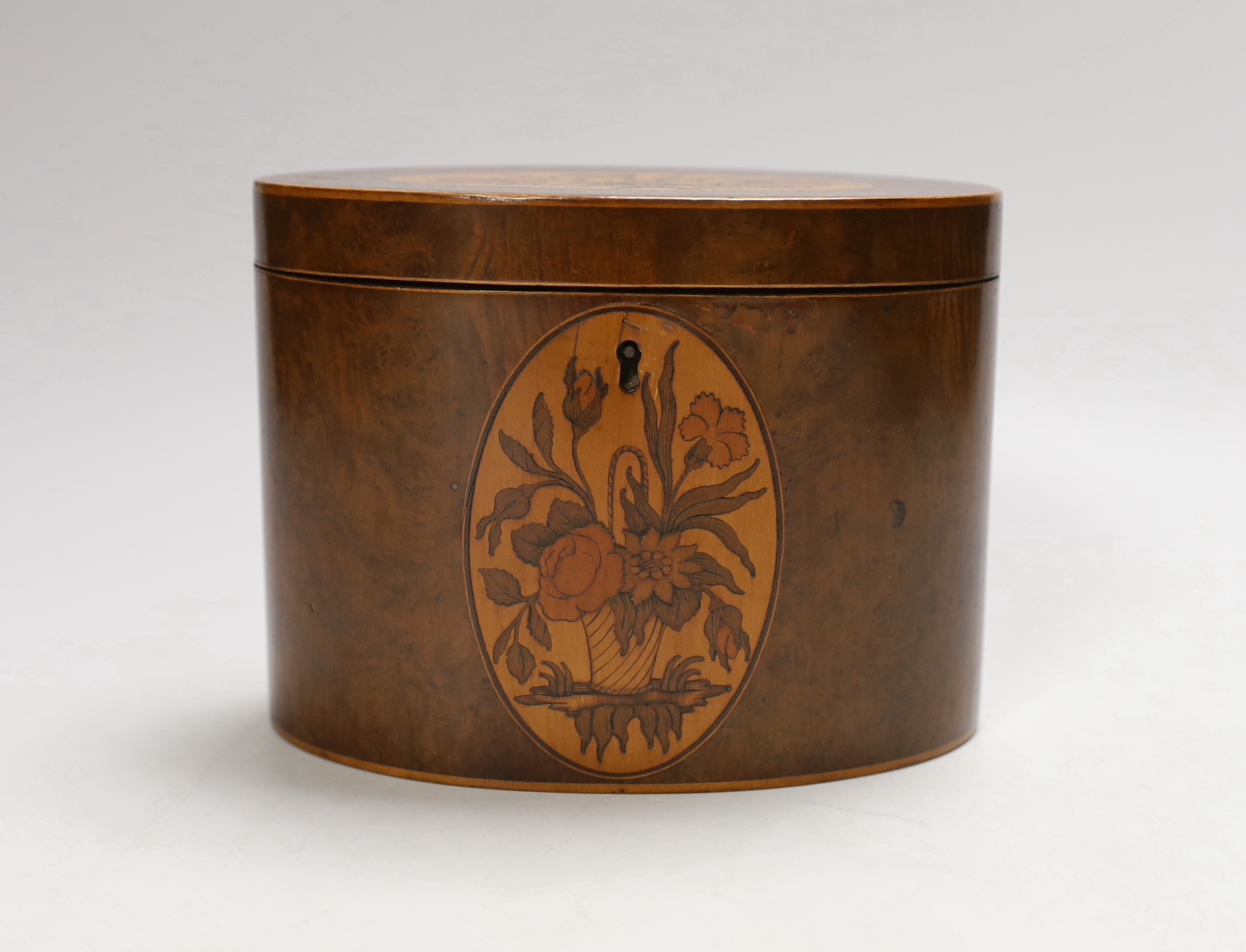 A George III Sheraton period burr walnut and marquetry elliptical tea caddy, 15cm wide                                                                                                                                      