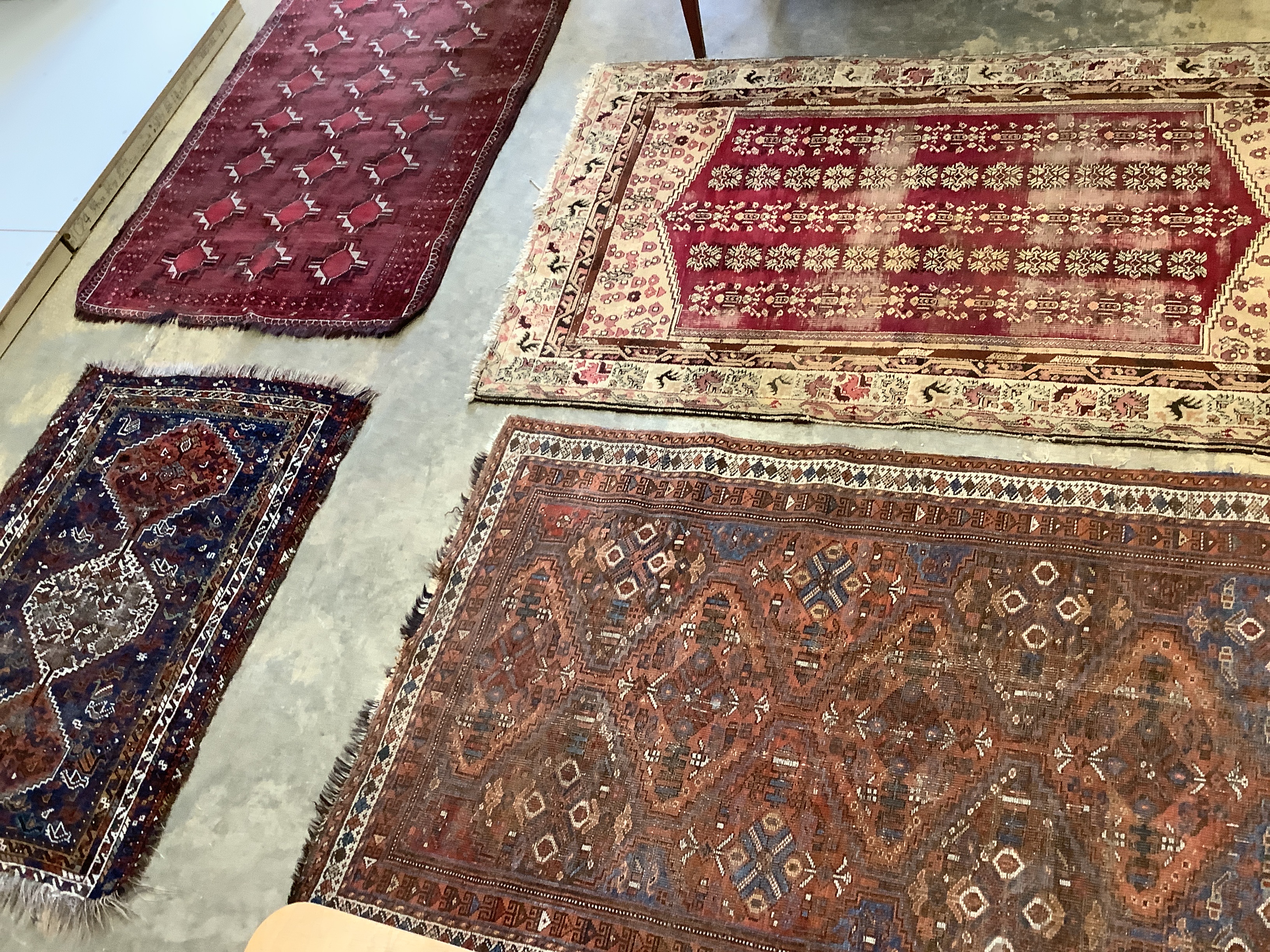 Two antique North West Persian blue ground rugs, a Turkish rug and a Belouch rug, largest 210 x 128cm                                                                                                                       