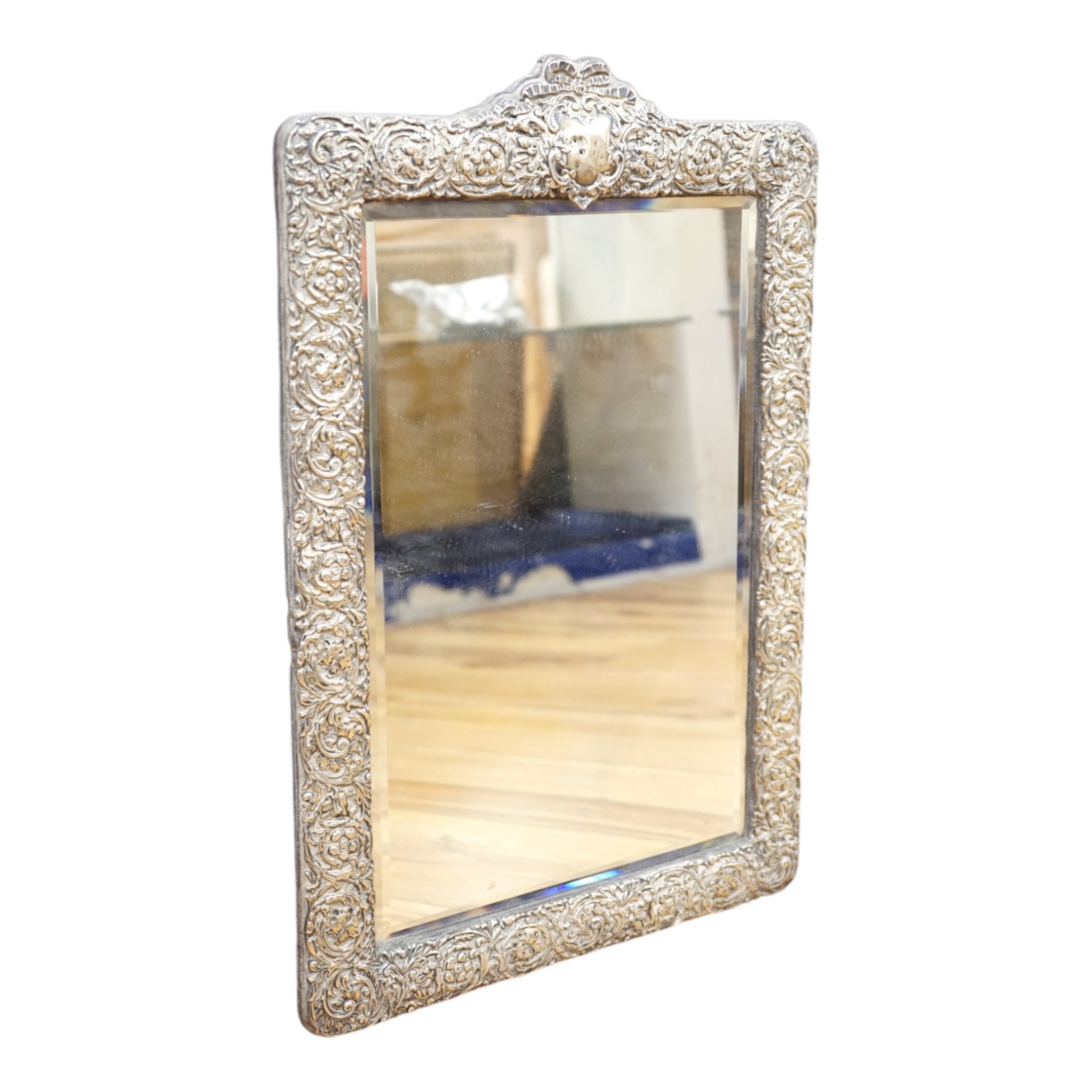 A large Edwardian repousse silver mounted easel mirror, Birmingham, 1905, 48.7cm. Condition - poor                                                                                                                          