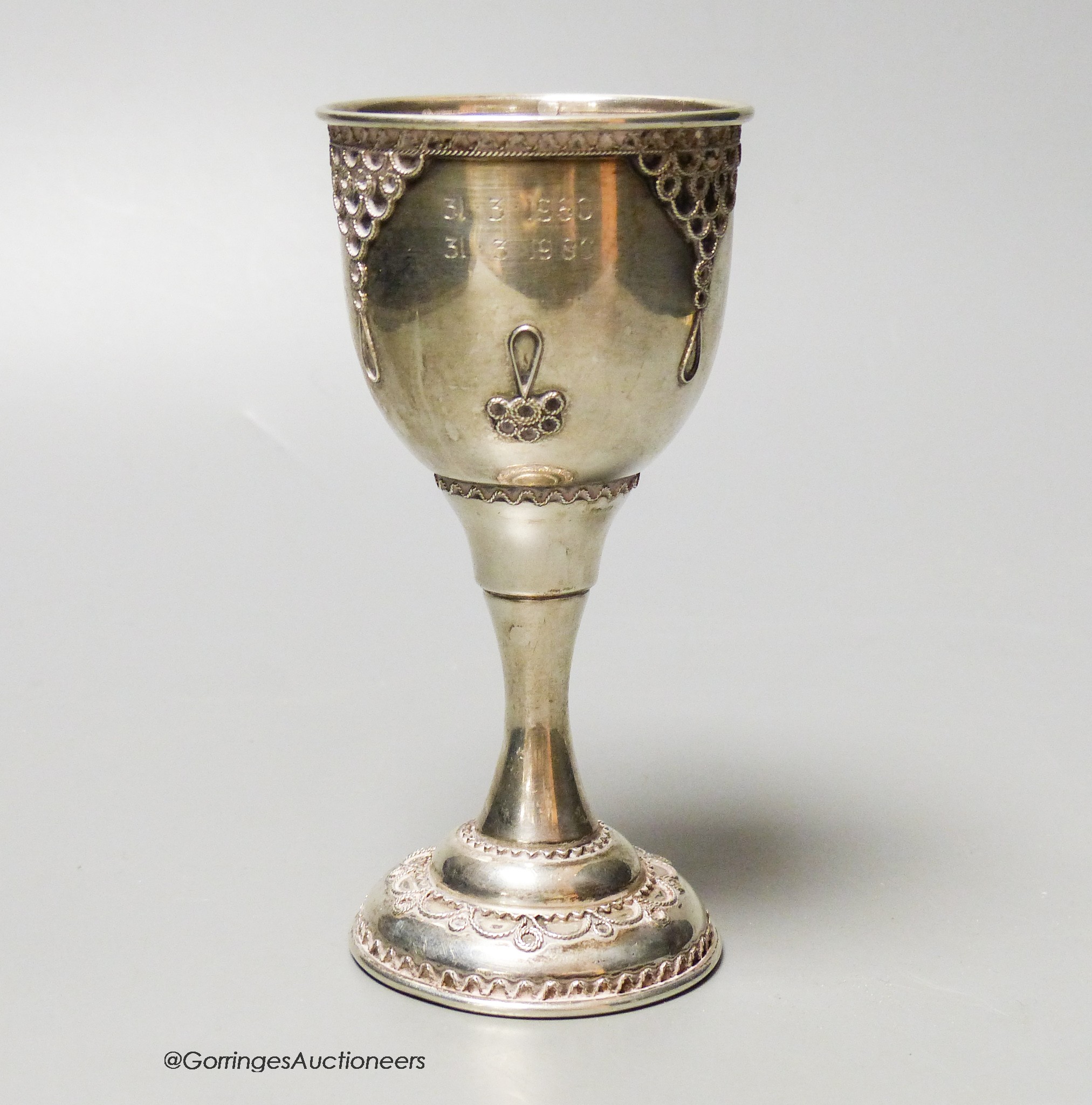 A modern silver goblet, with filigree decoration, London, 1980, 13.2cm, 73 grams.                                                                                                                                           