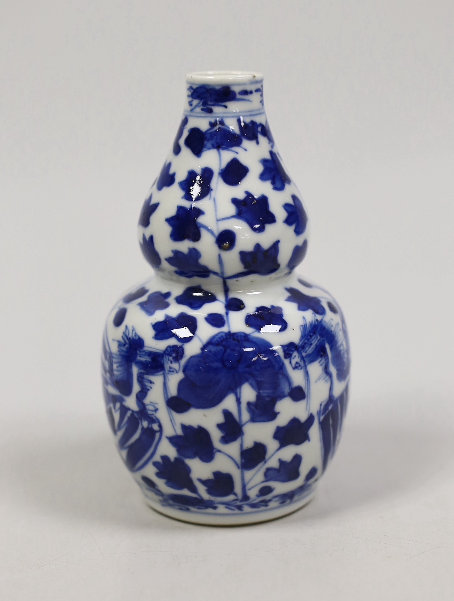 A small Chinese blue and white double gourd vase, c.1900. 12cm tall                                                                                                                                                         